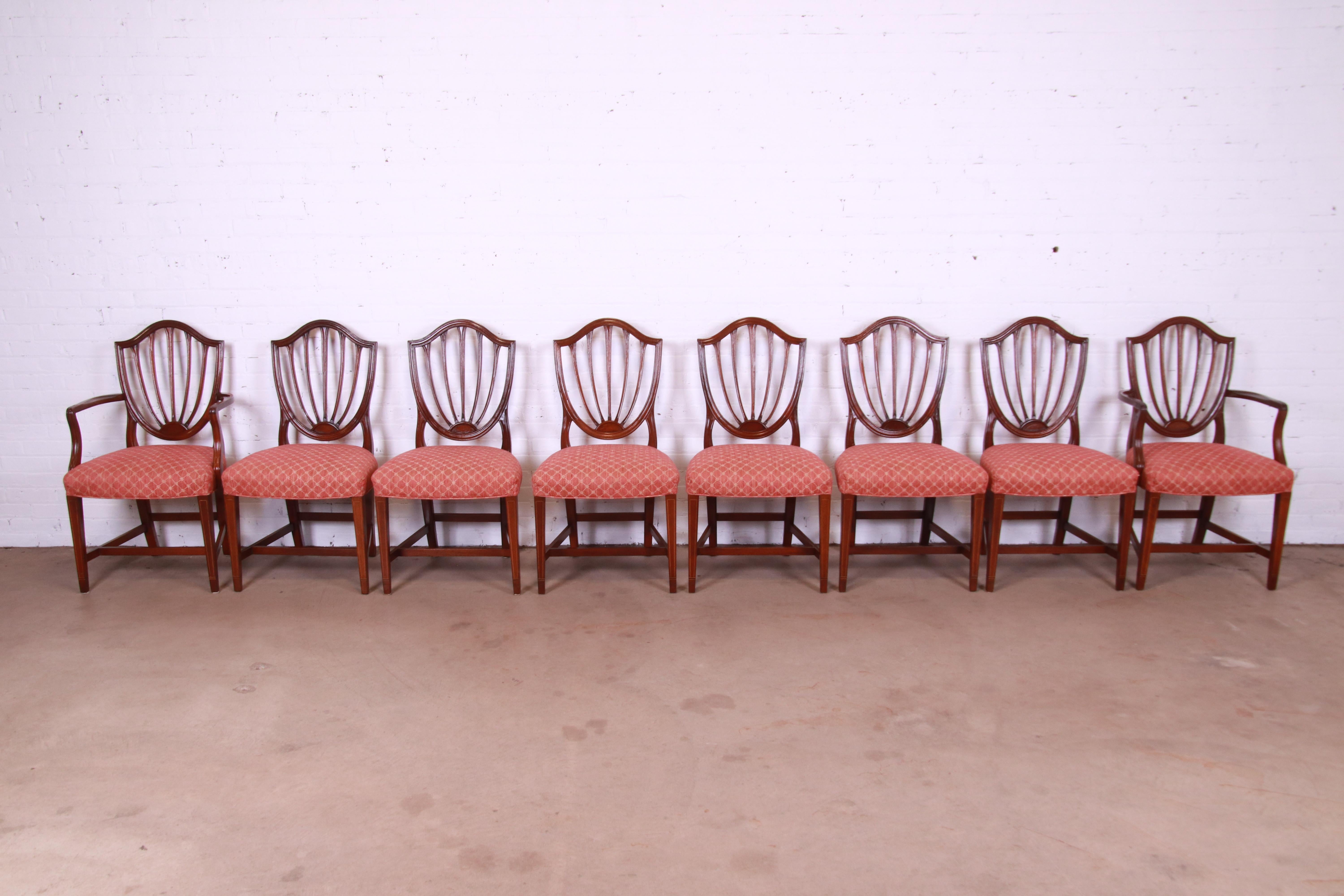 A gorgeous set of eight Federal or Georgian style shield back dining chairs

By Baker Furniture, 