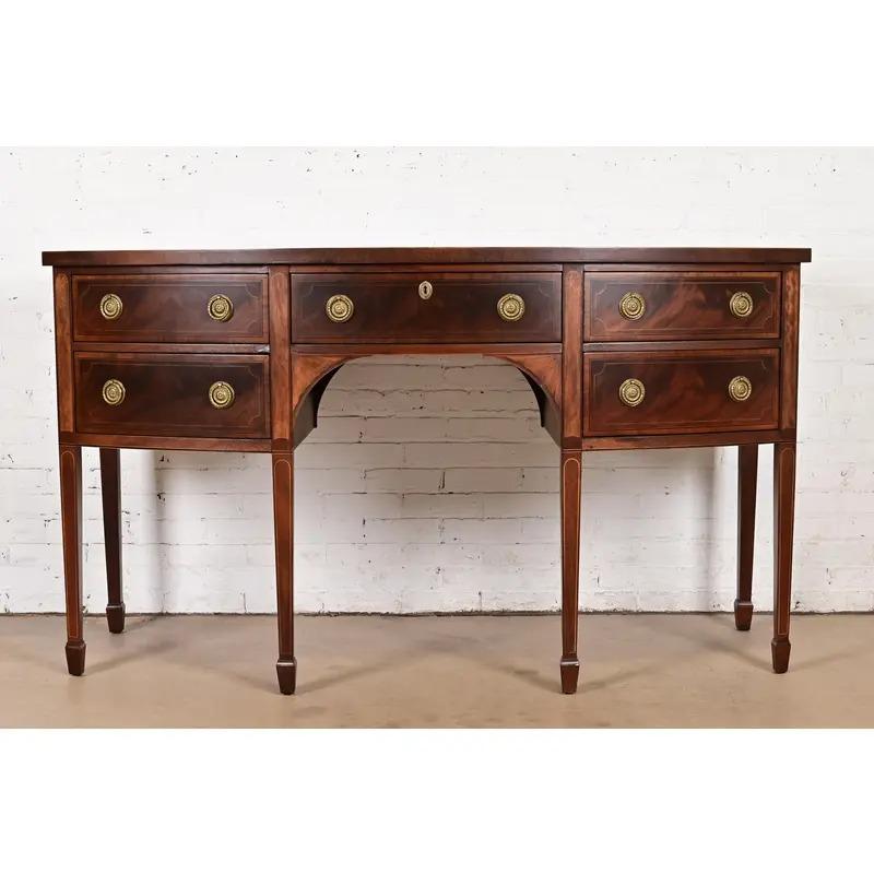 A gorgeous Federal or Hepplewhite style bow front sideboard buffet or credenza

By Baker Furniture, 