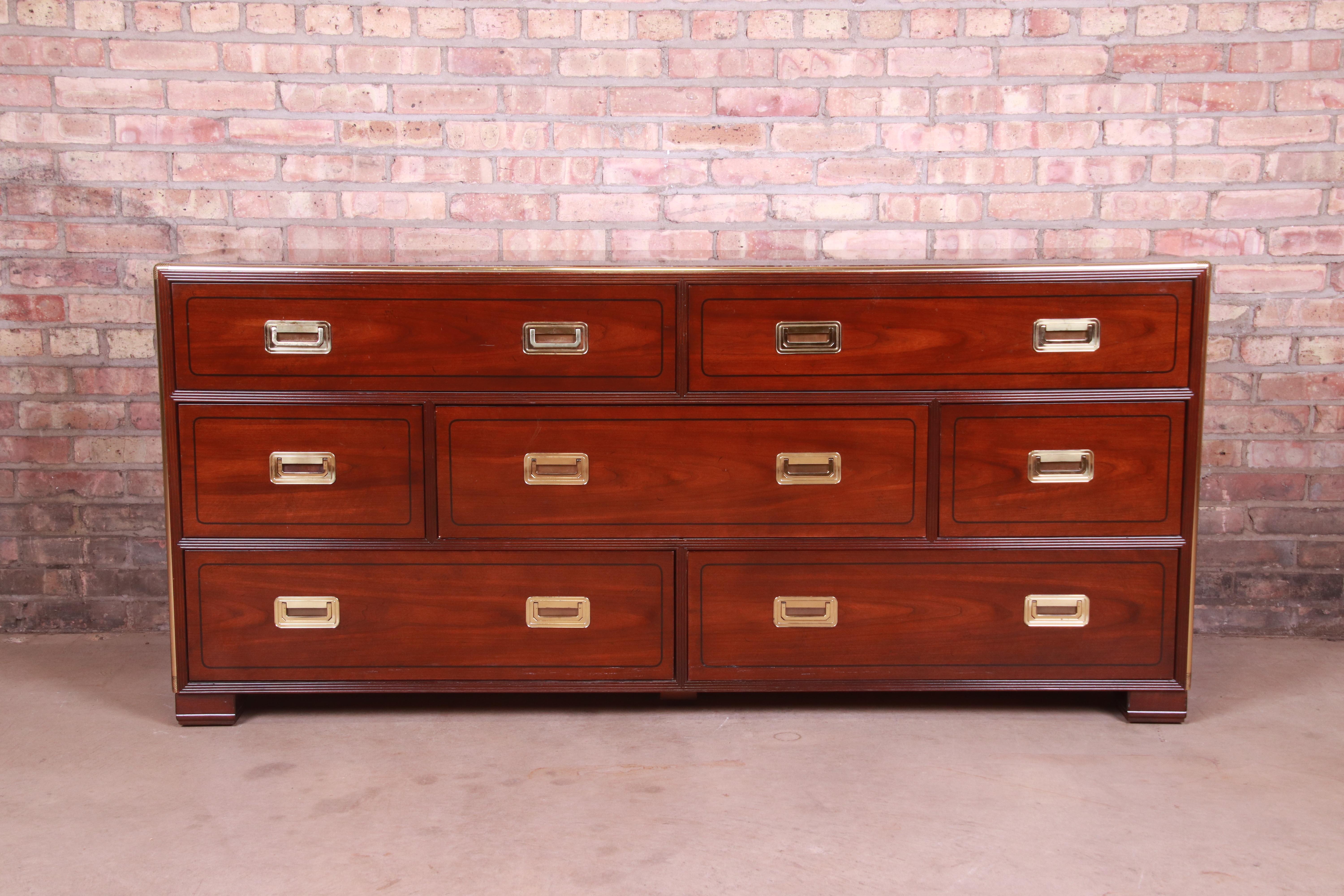A gorgeous Hollywood Regency Campaign style long dresser or credenza

By Baker Furniture

USA, Circa 1970s

Mahogany, with original brass hardware and brass trim.

Measures: 67.75