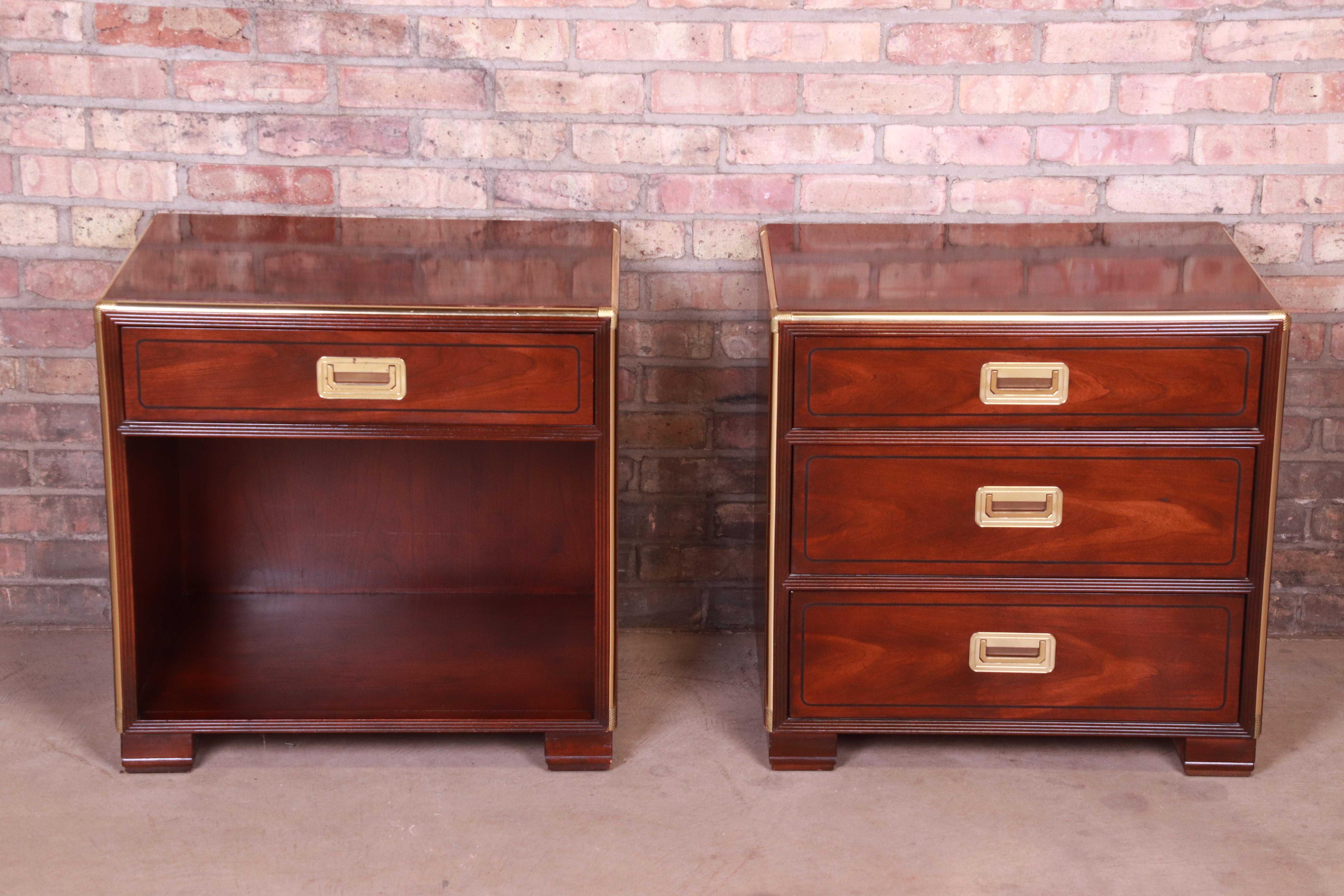 An exceptional pair of midcentury Hollywood Regency Campaign style bedside chests

By Baker Furniture

USA, circa 1970s

Bookmatched mahogany, with brass trim and hardware.

Measures: 25.25