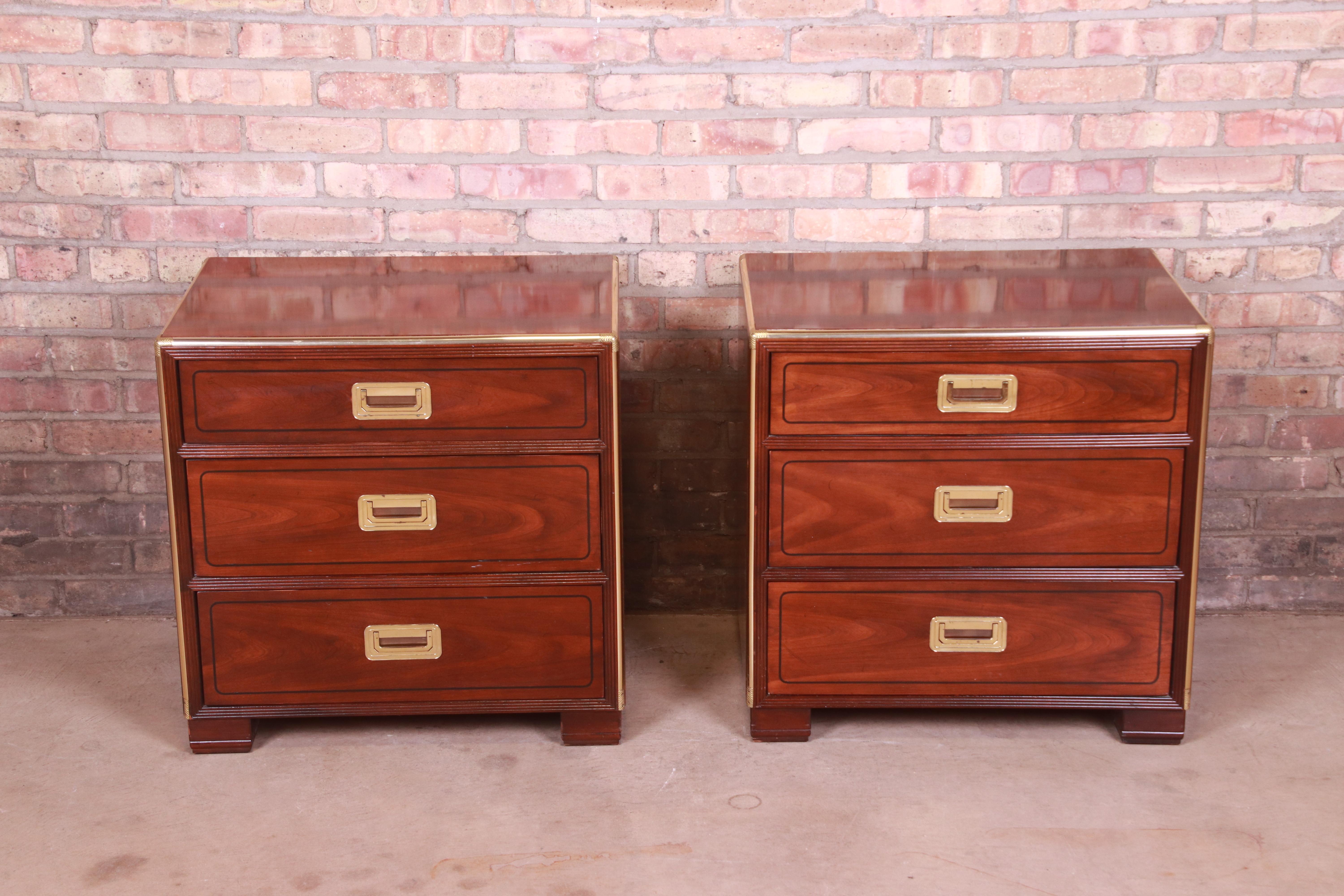 An exceptional pair of mid-century Hollywood Regency Campaign style bedside chests

By Baker Furniture,

USA, Circa 1970s

Book-matched mahogany, with brass trim and hardware.

Measures: 25