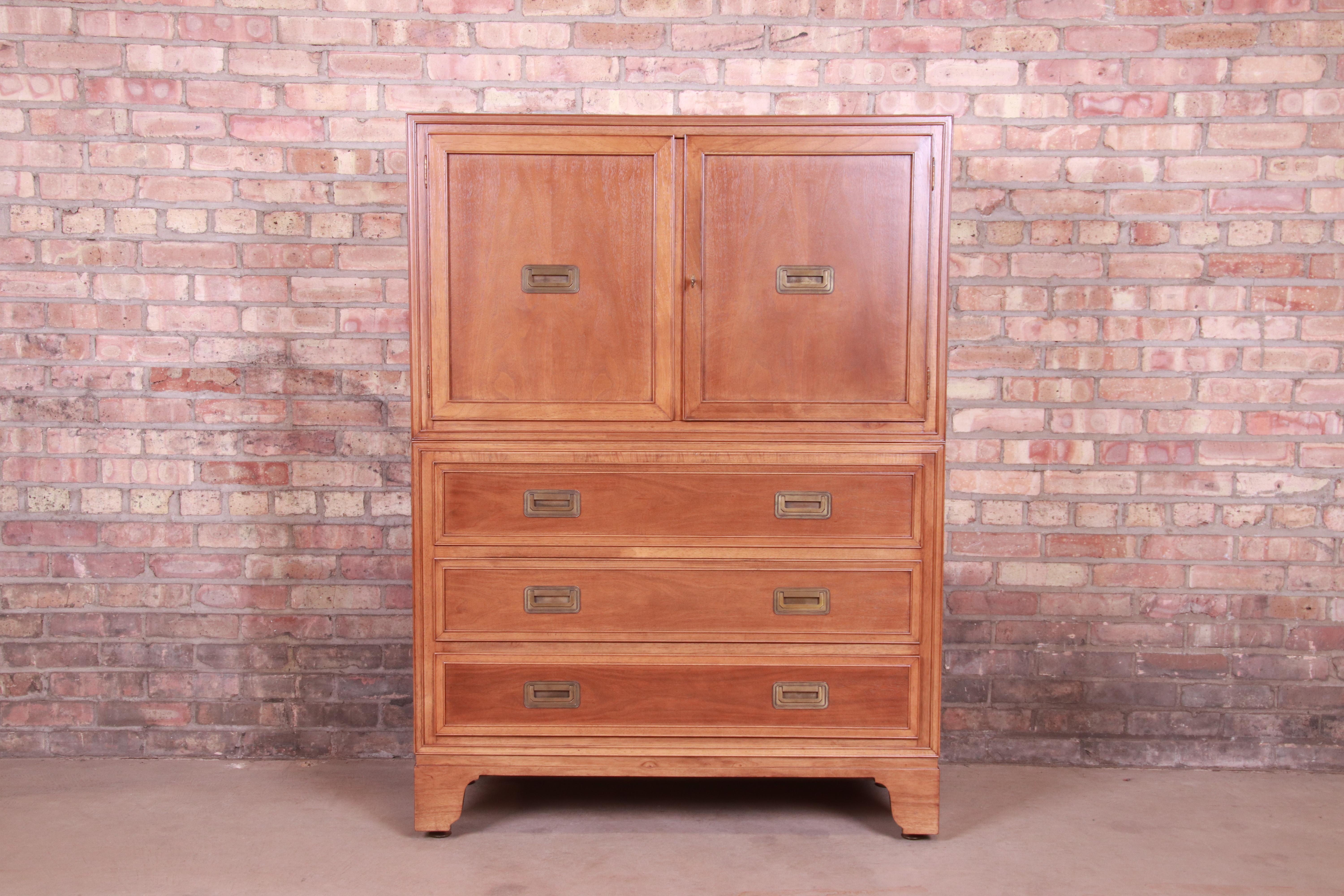 An exceptional Mid-Century Modern Hollywood Regency Campaign style gentleman's chest or highboy dresser

By Baker Furniture 