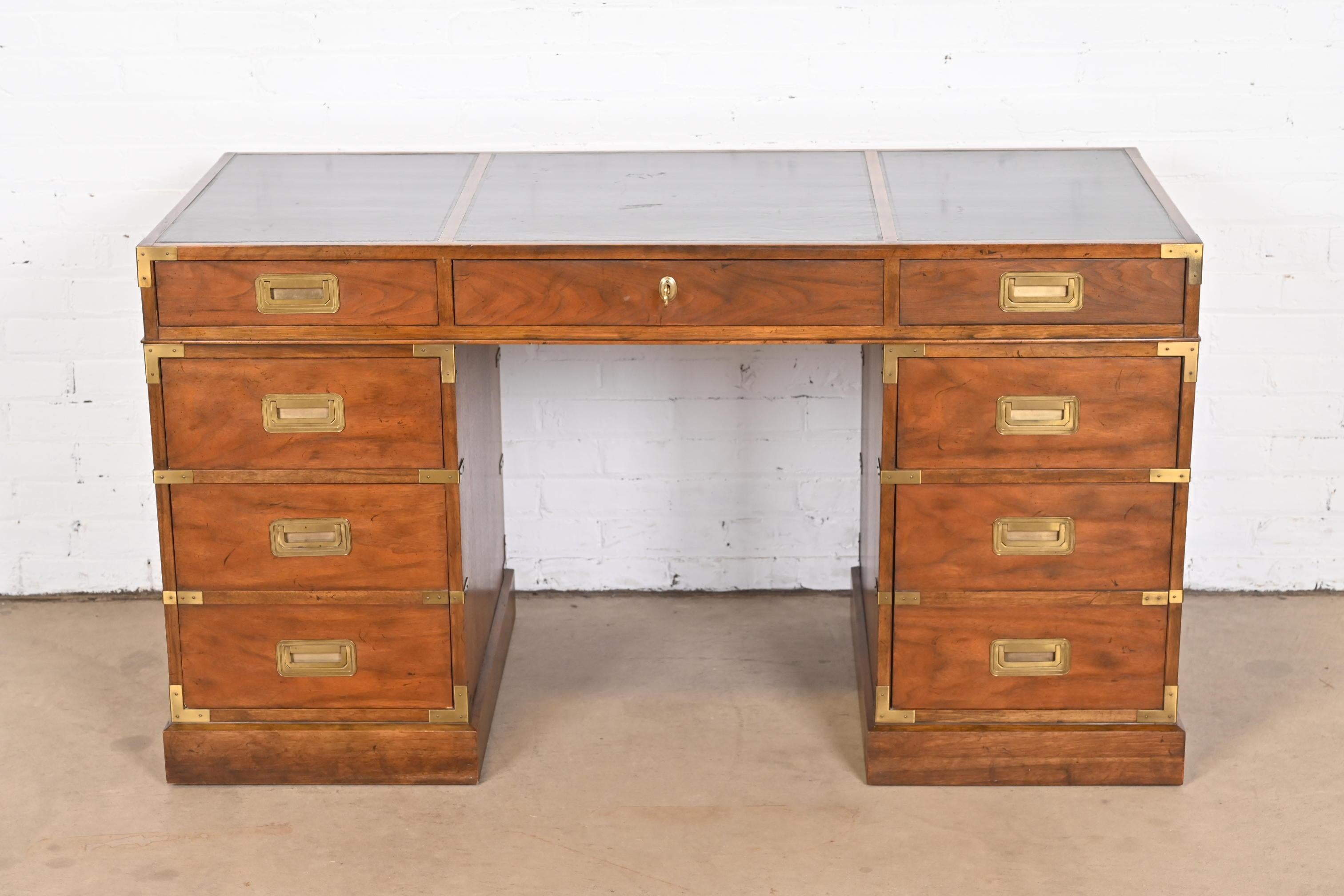 A gorgeous mid-century modern Hollywood Regency Campaign style executive writing desk

By Baker Furniture, 