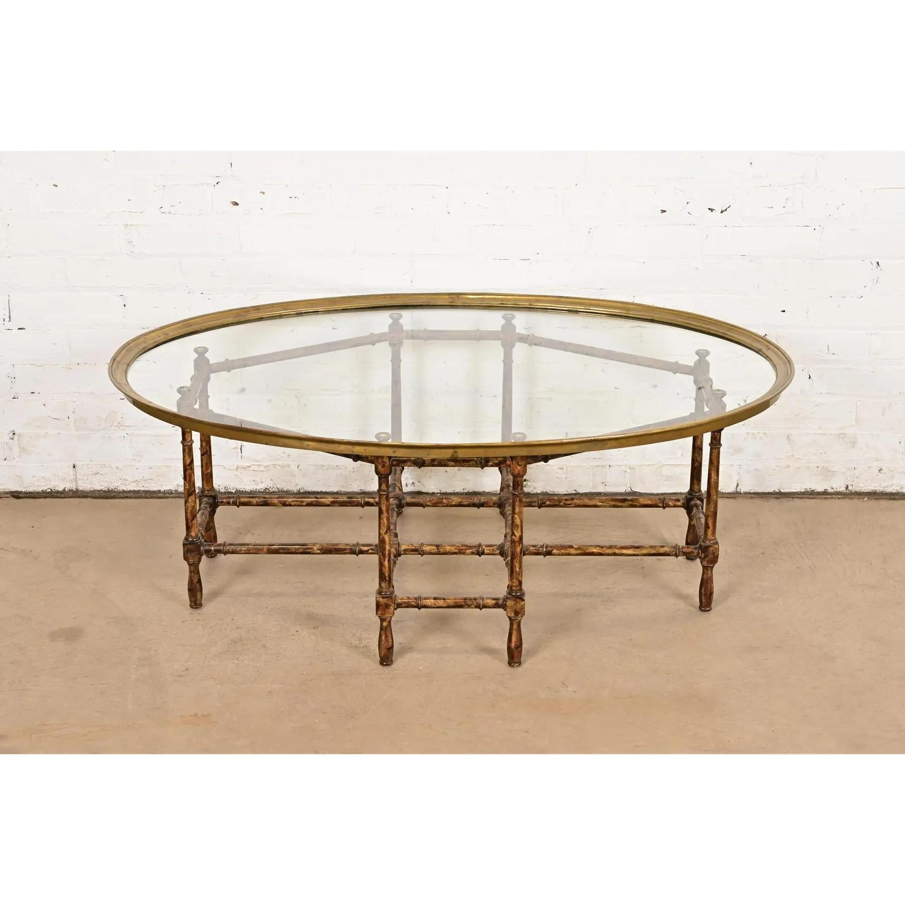 A gorgeous mid-century modern Hollywood Regency Chinoiserie coffee table or cocktail table

By Baker Furniture

USA, Circa 1960s

Faux bamboo base in tortoise shell finish, with brass mounted glass top.

Measures: 44.25