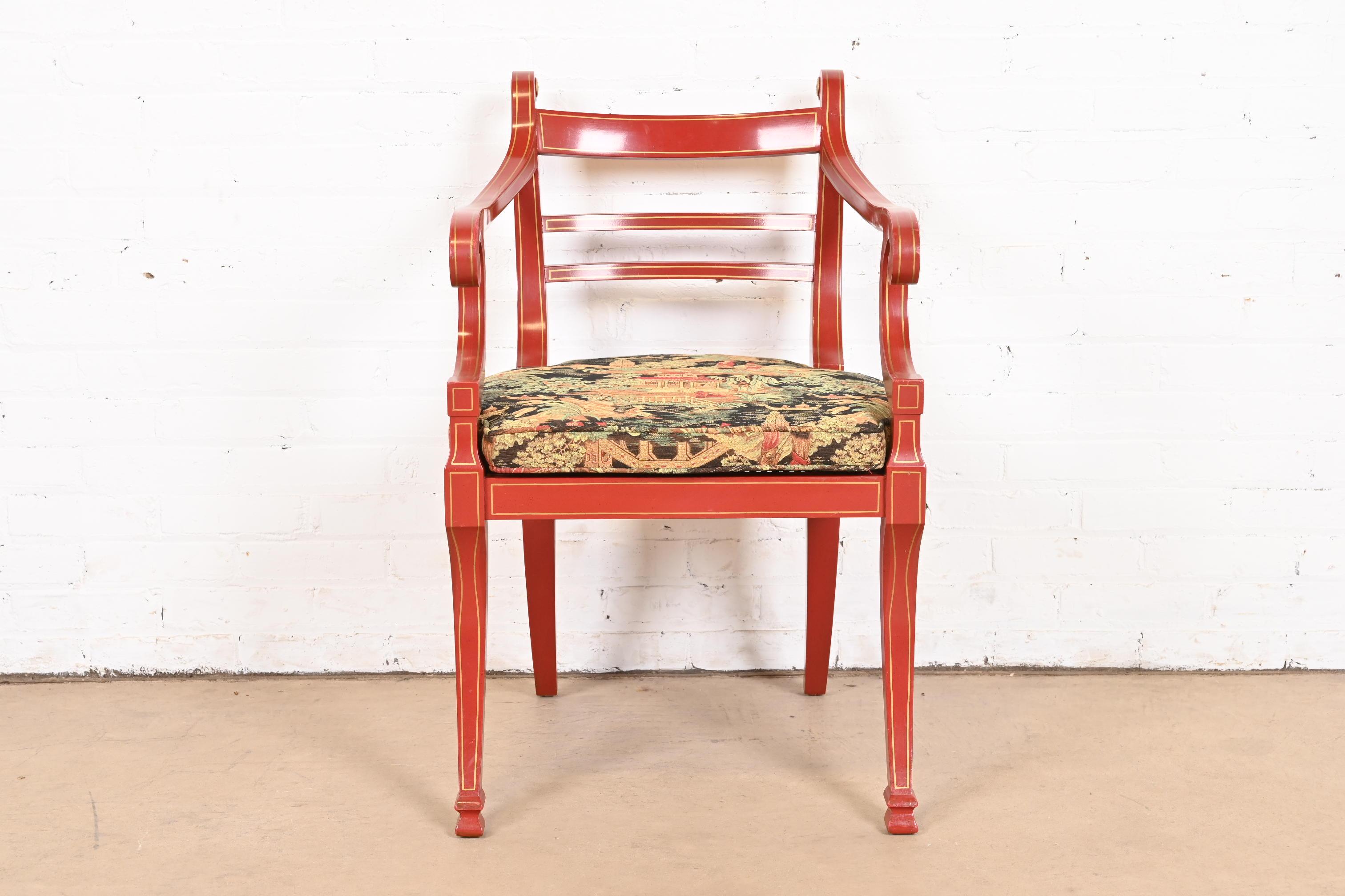 A beautiful Hollywood Regency Chinoiserie style armchair

By Baker Furniture

USA, Late 20th Century

Red lacquered and gold gilt mahogany frame, with caned seat, and upholstered cushion with Asian nature scenes.

Measures: 21