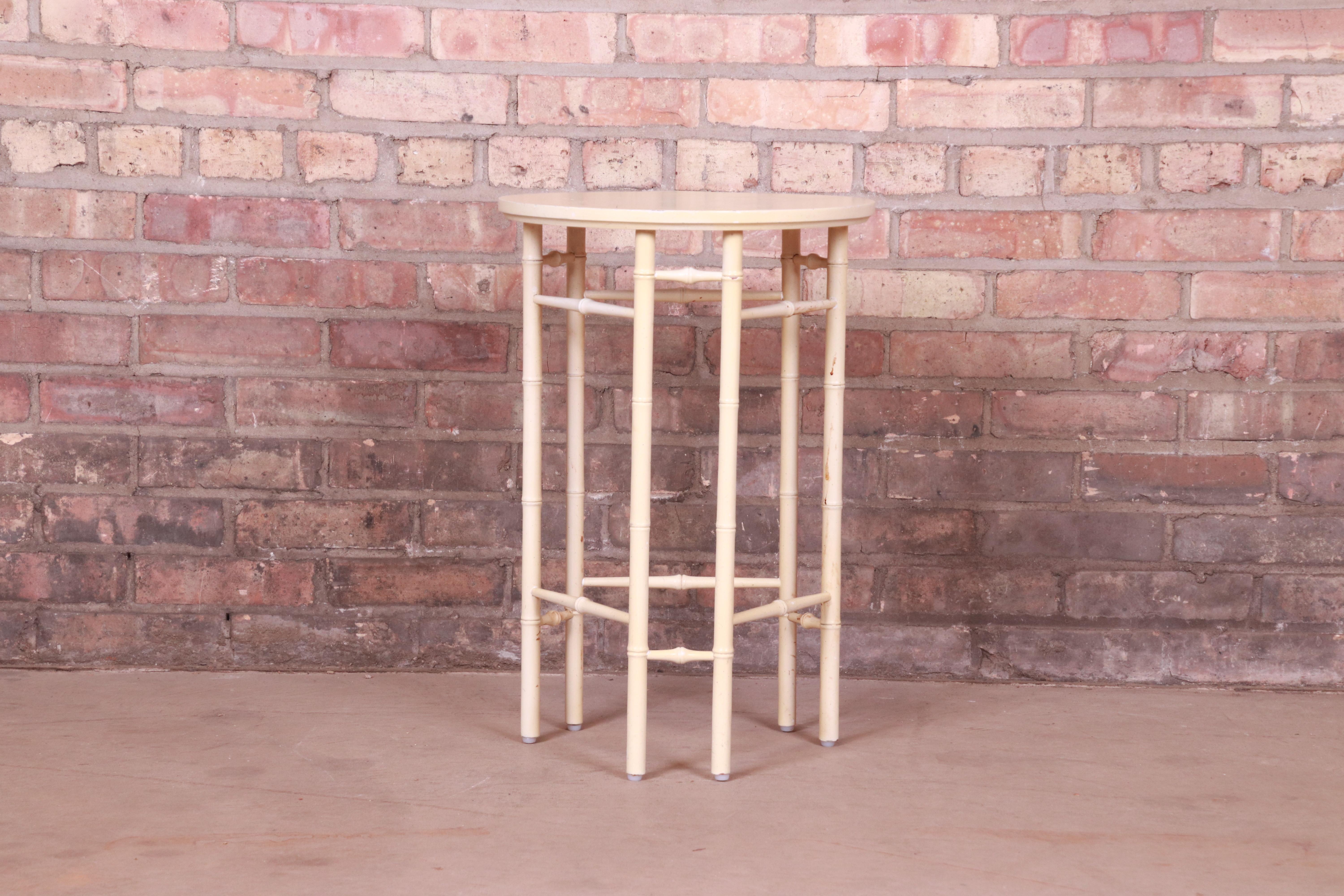 A gorgeous Mid-Century Modern Hollywood Regency Chinoiserie occasional side table or tea table

By Baker Furniture

USA, Circa 1960s

Bamboo form legs and stretchers, with cream lacquered finish.

Measures: 15