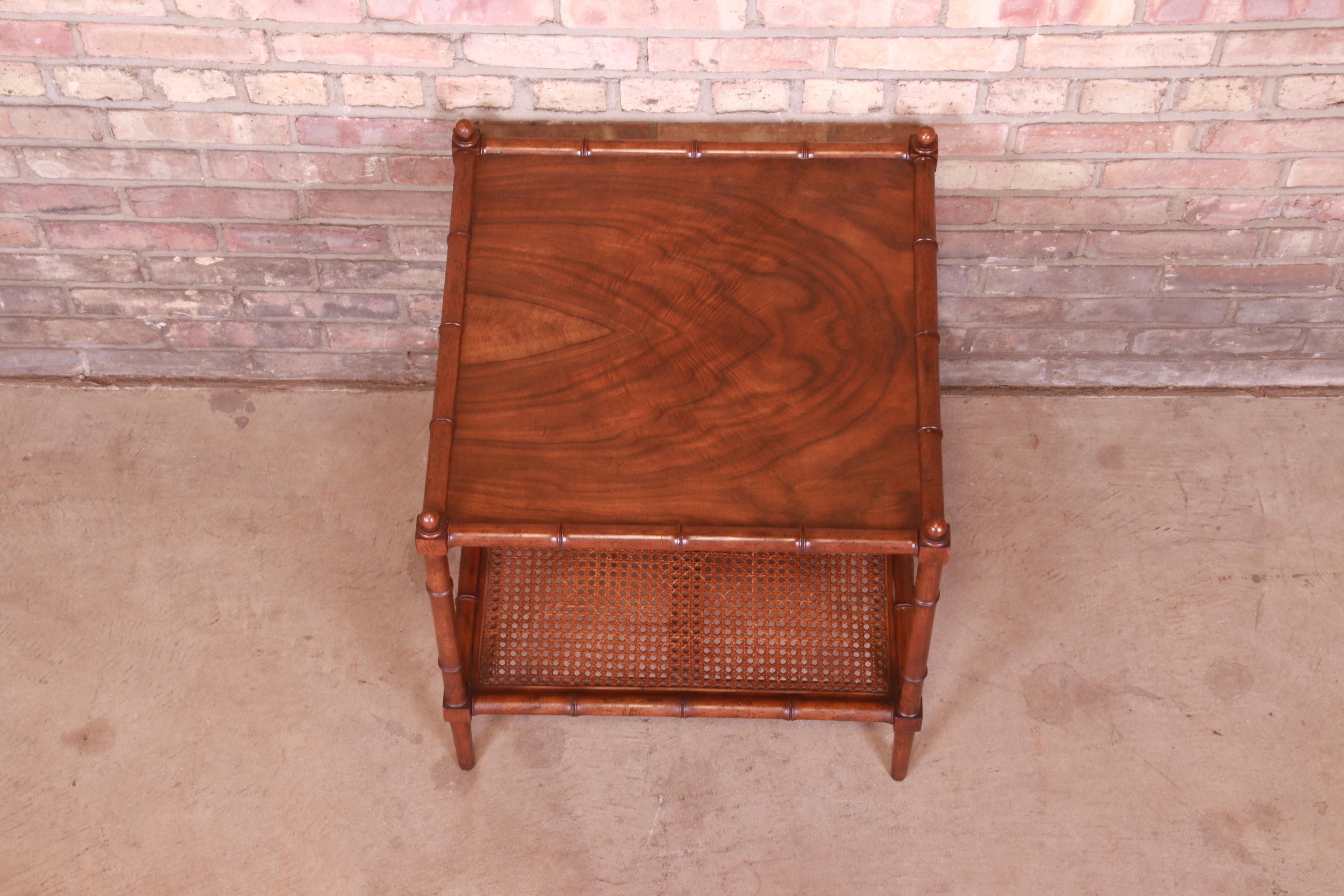 20th Century Baker Furniture Hollywood Regency Walnut, Faux Bamboo, and Cane Side Table