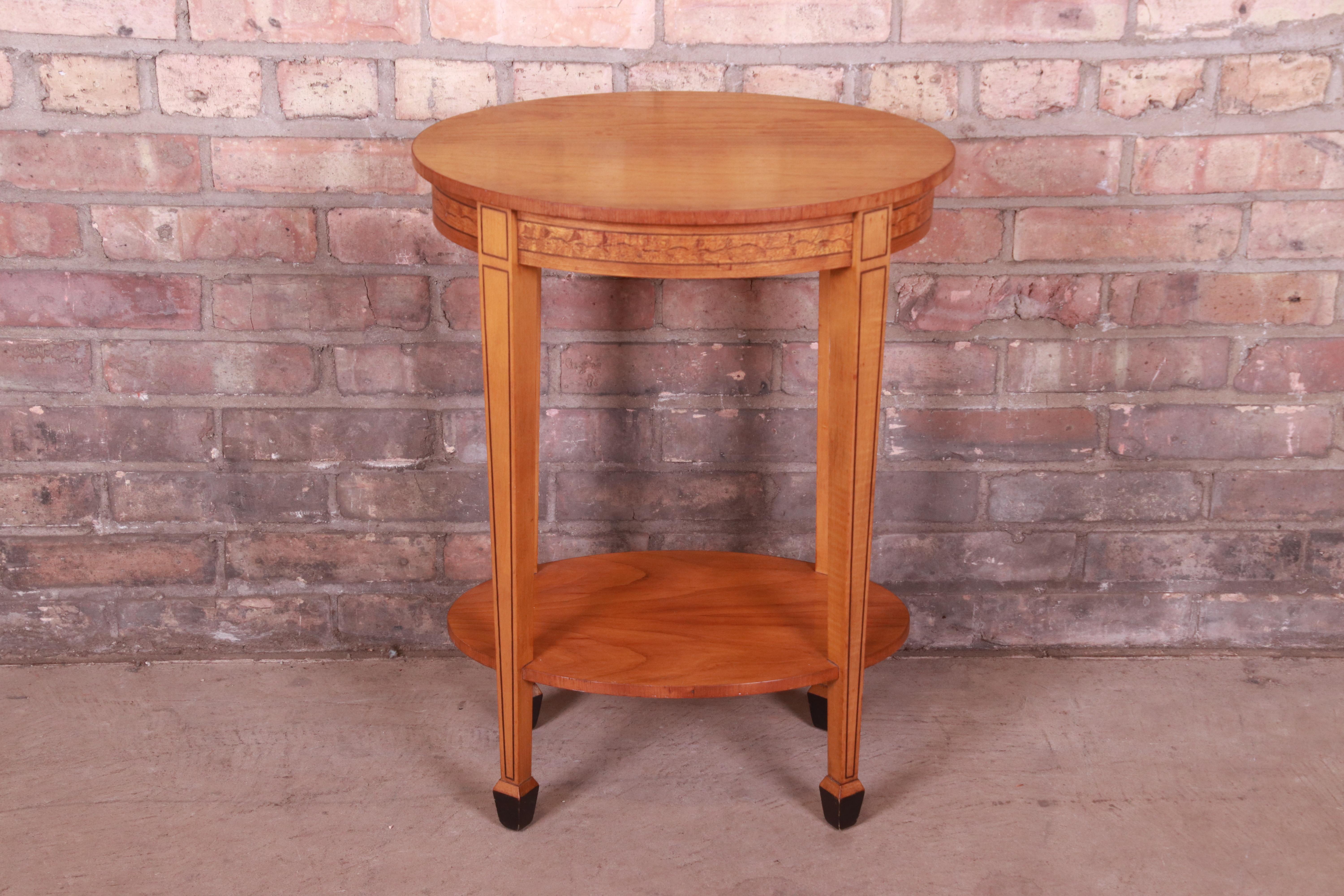 A gorgeous Federal style side table or nightstand

By Laura Ashley for Baker Furniture

USA, Circa 1990s

Mahogany with inlaid floral marquetry, string inlay, and ebonized feet.

Measures: 18