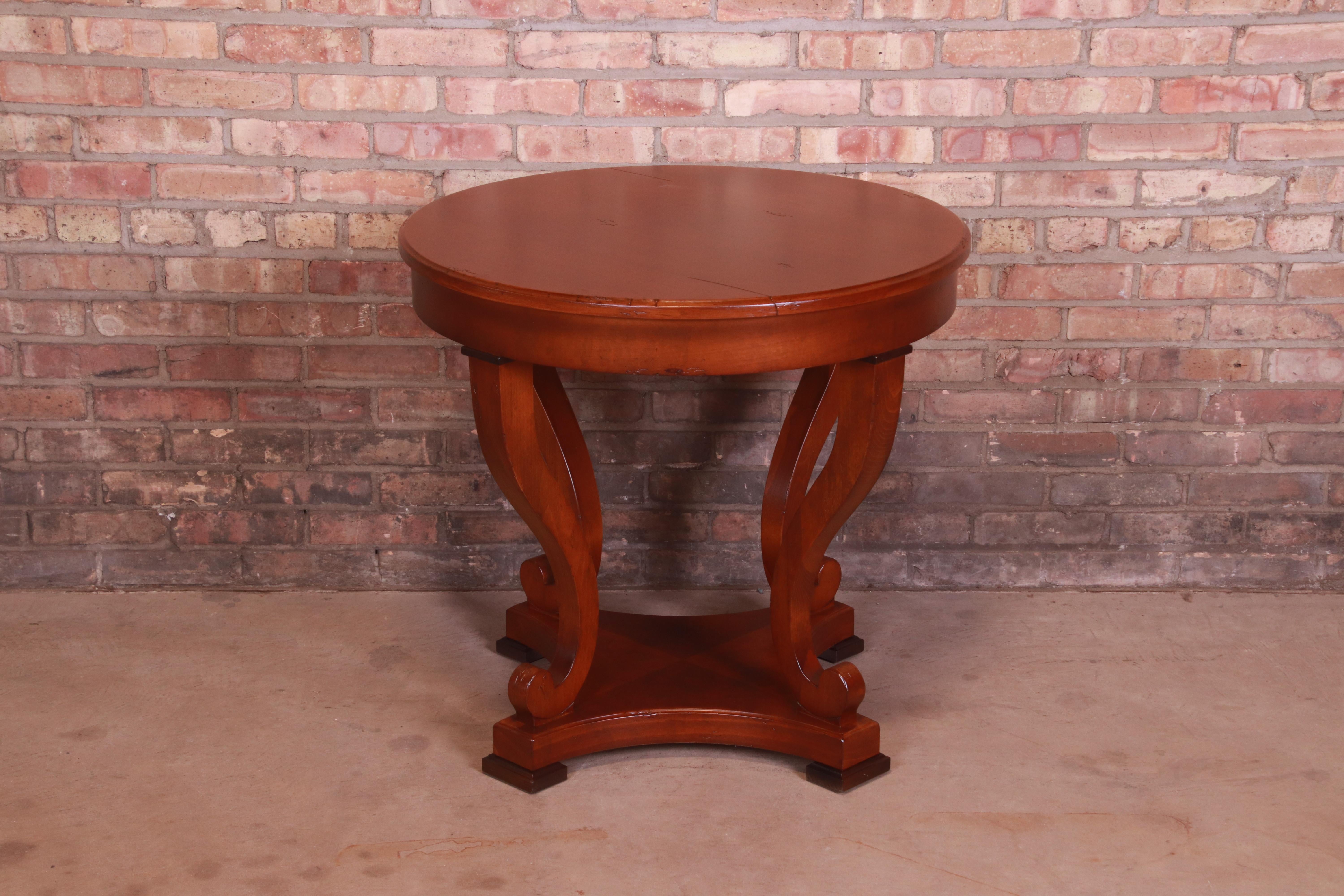 A gorgeous Italian Provincial carved mahogany tea table or center table

By Baker Furniture, 