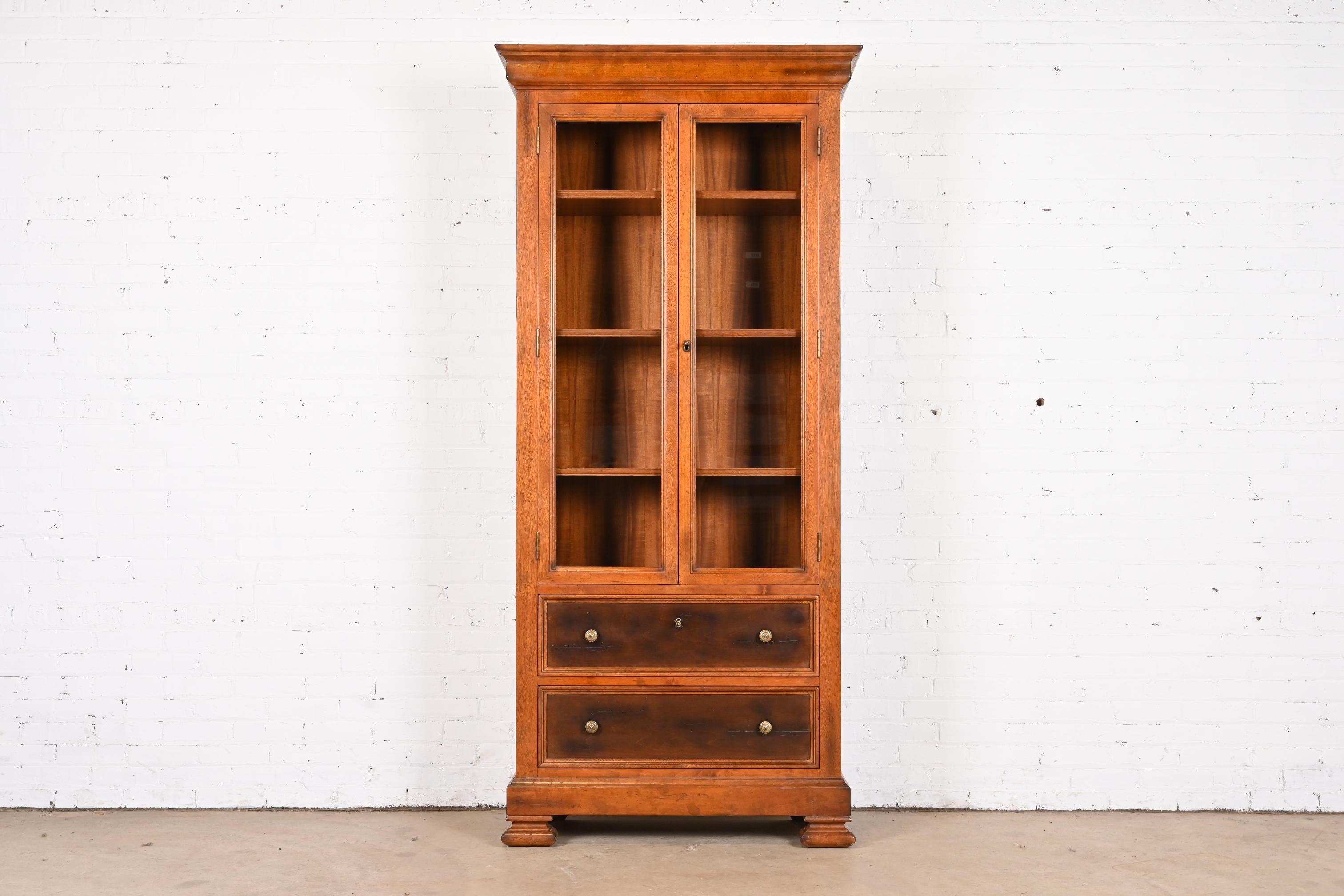 An outstanding Italian Provincial or Rustic European style bibliotheque bookcase cabinet

By Baker Furniture, 