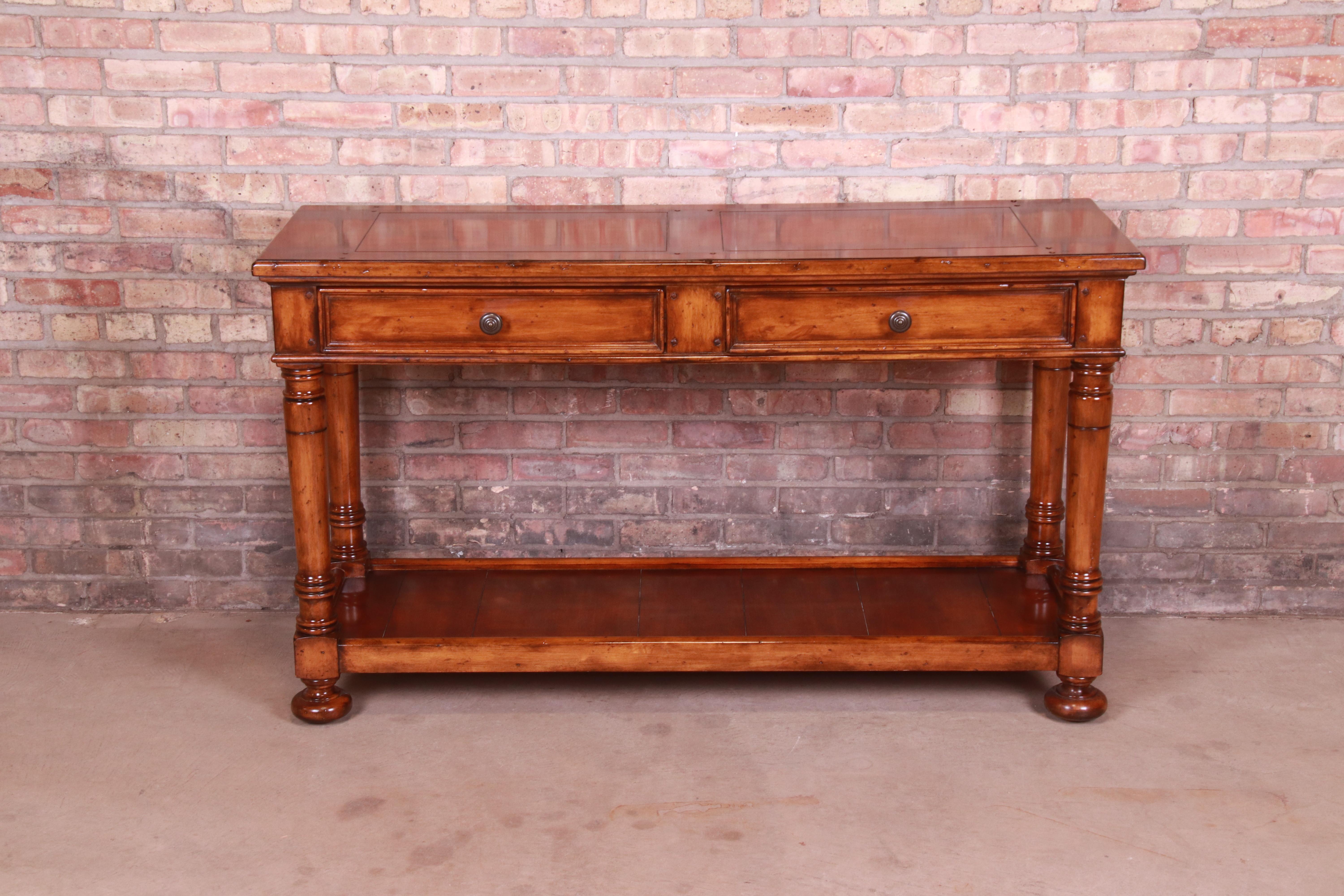 A gorgeous Italian Provincial maple two-tier console table or sofa table

By Baker Furniture 
