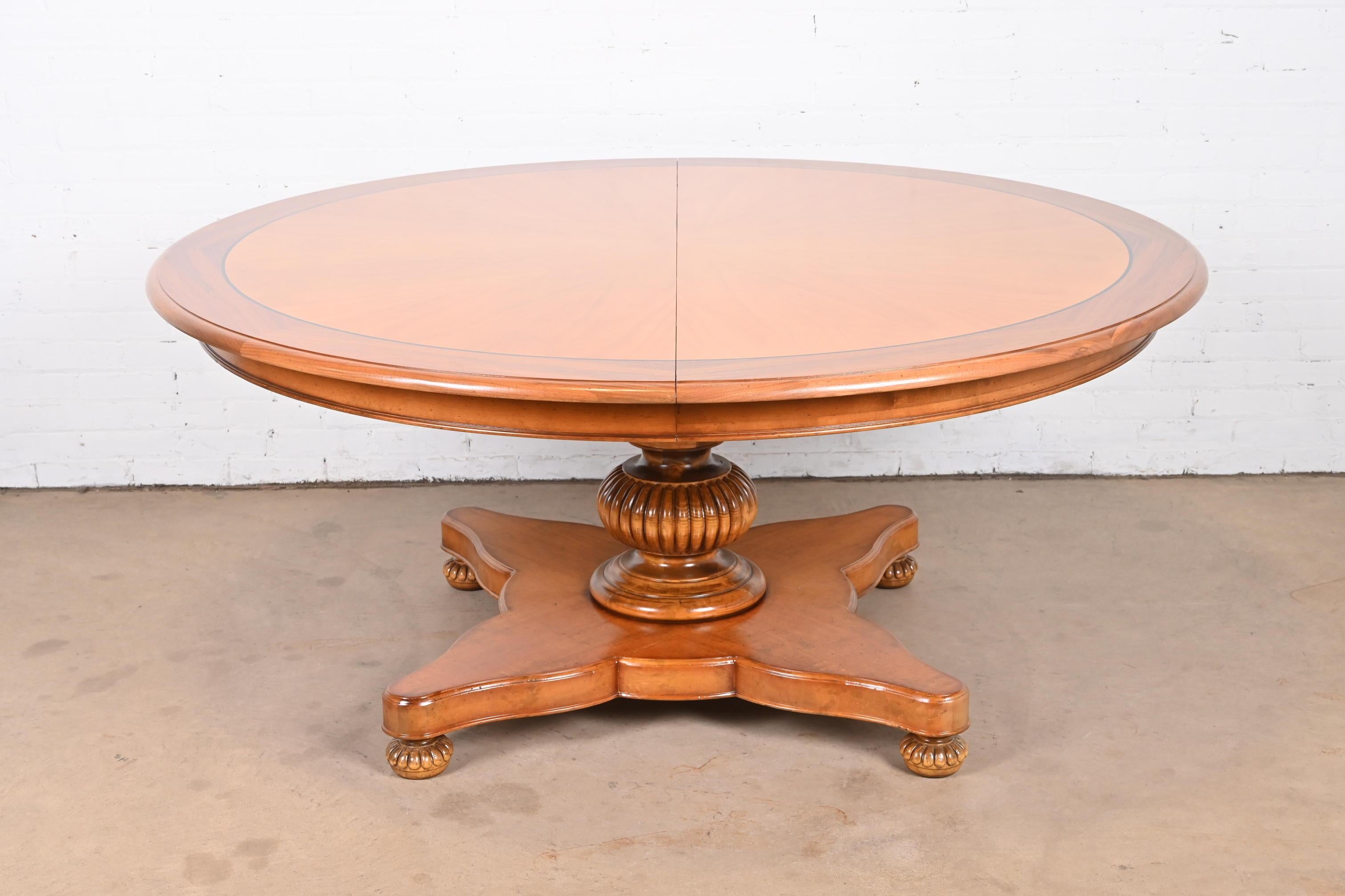 An outstanding large Italian Provincial or Neoclassical style pedestal extension dining table

By Baker Furniture, 