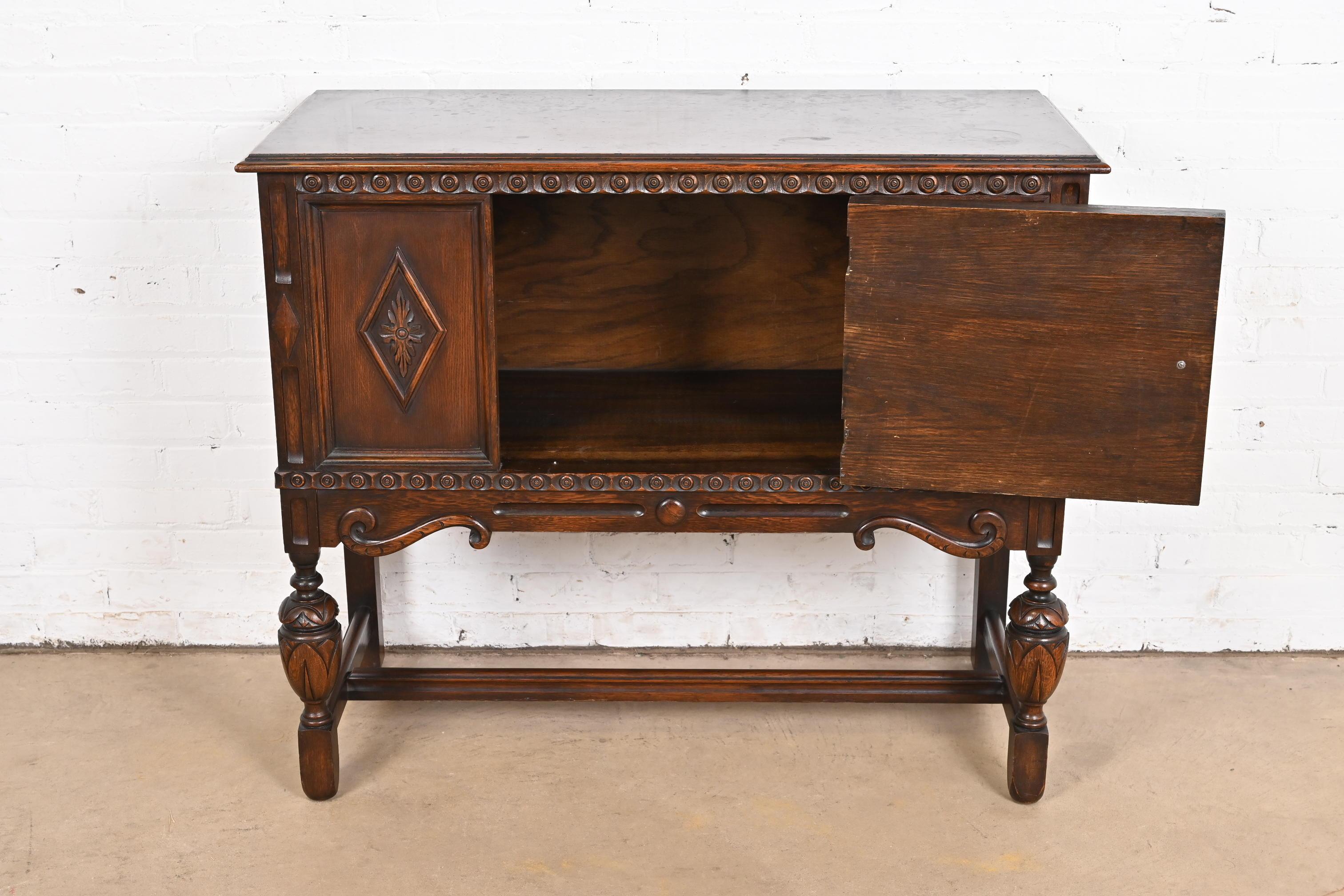 Baker Furniture Jacobean Carved Oak Sideboard Buffet or Bar Cabinet, Circa 1920s 1