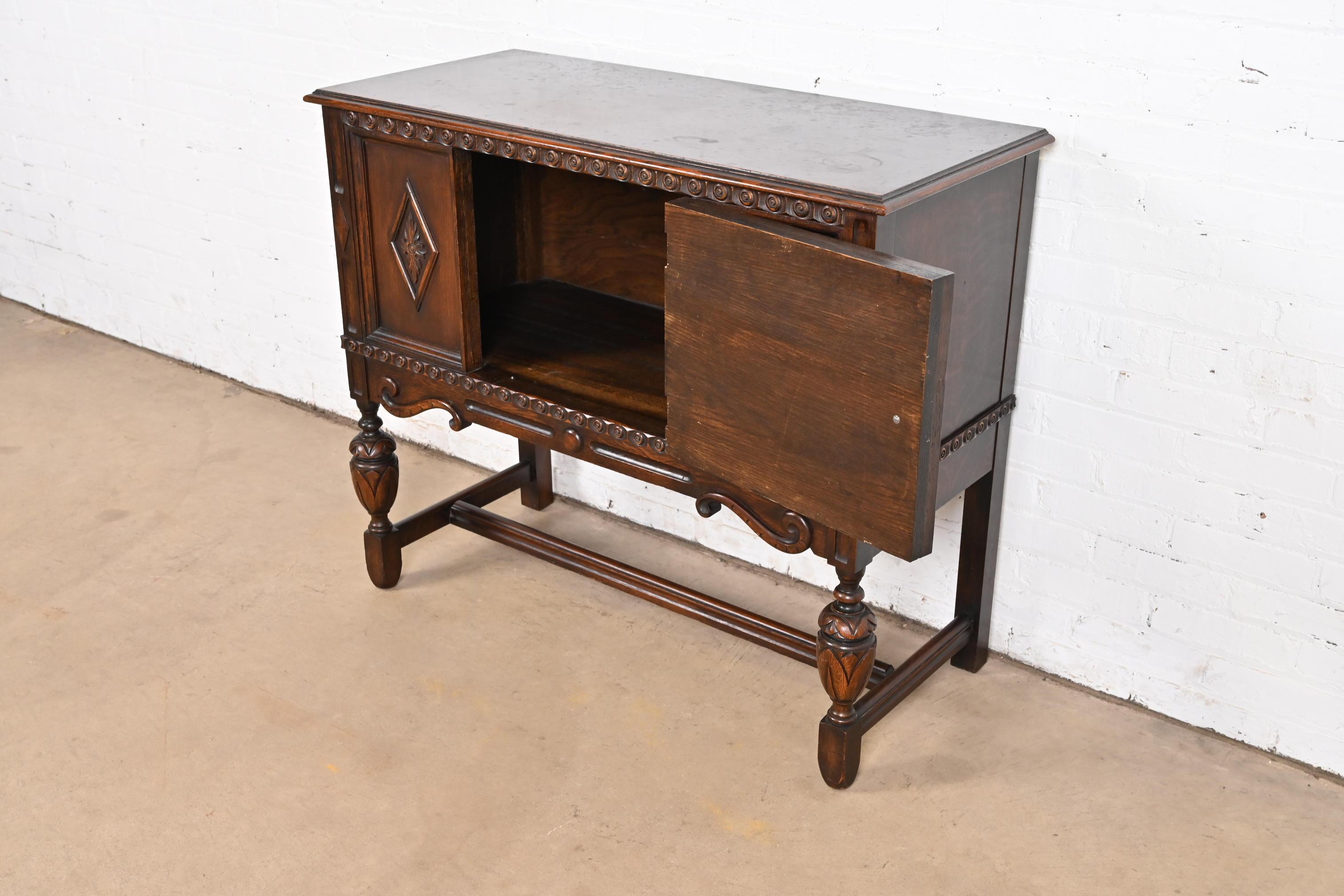 Baker Furniture Jacobean Carved Oak Sideboard Buffet or Bar Cabinet, Circa 1920s 2