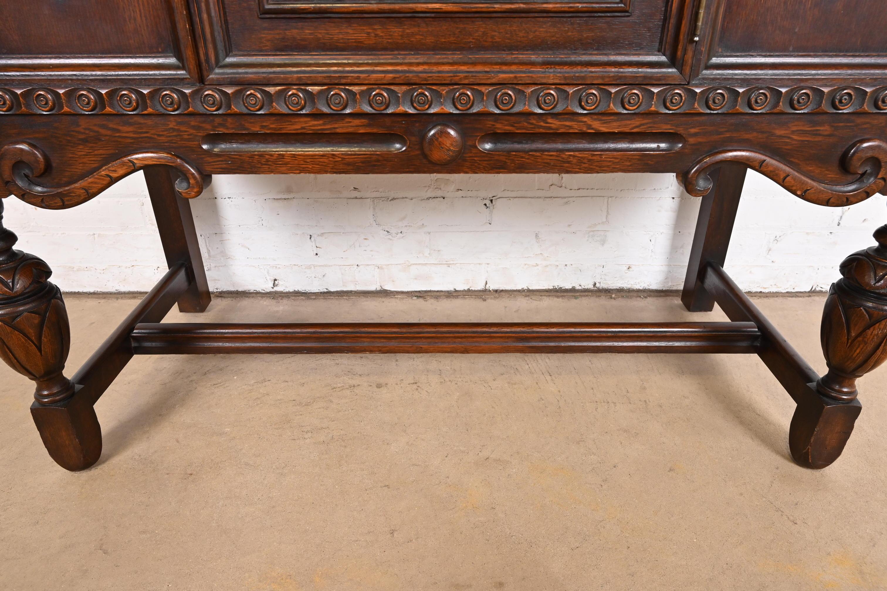 Baker Furniture Jacobean Carved Oak Sideboard Buffet or Bar Cabinet, Circa 1920s 4