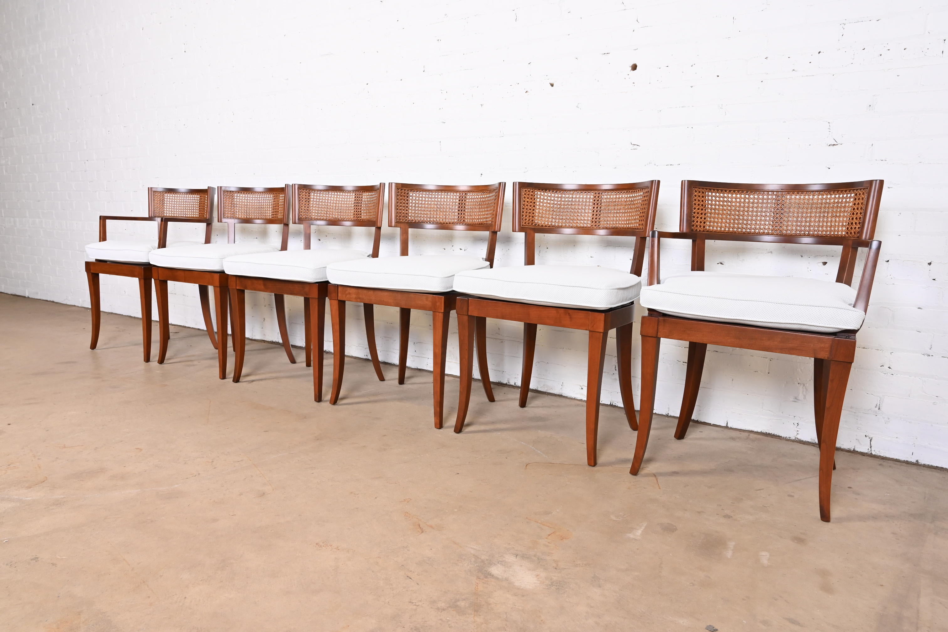 An outstanding set of six Klismos dining chairs

By Baker Furniture

USA, 1950s

Elegant solid cherry wood frames, with cane seats and backs, and freshly reupholstered cushions in white designer upholstery.

Measures:
Side chairs - 20