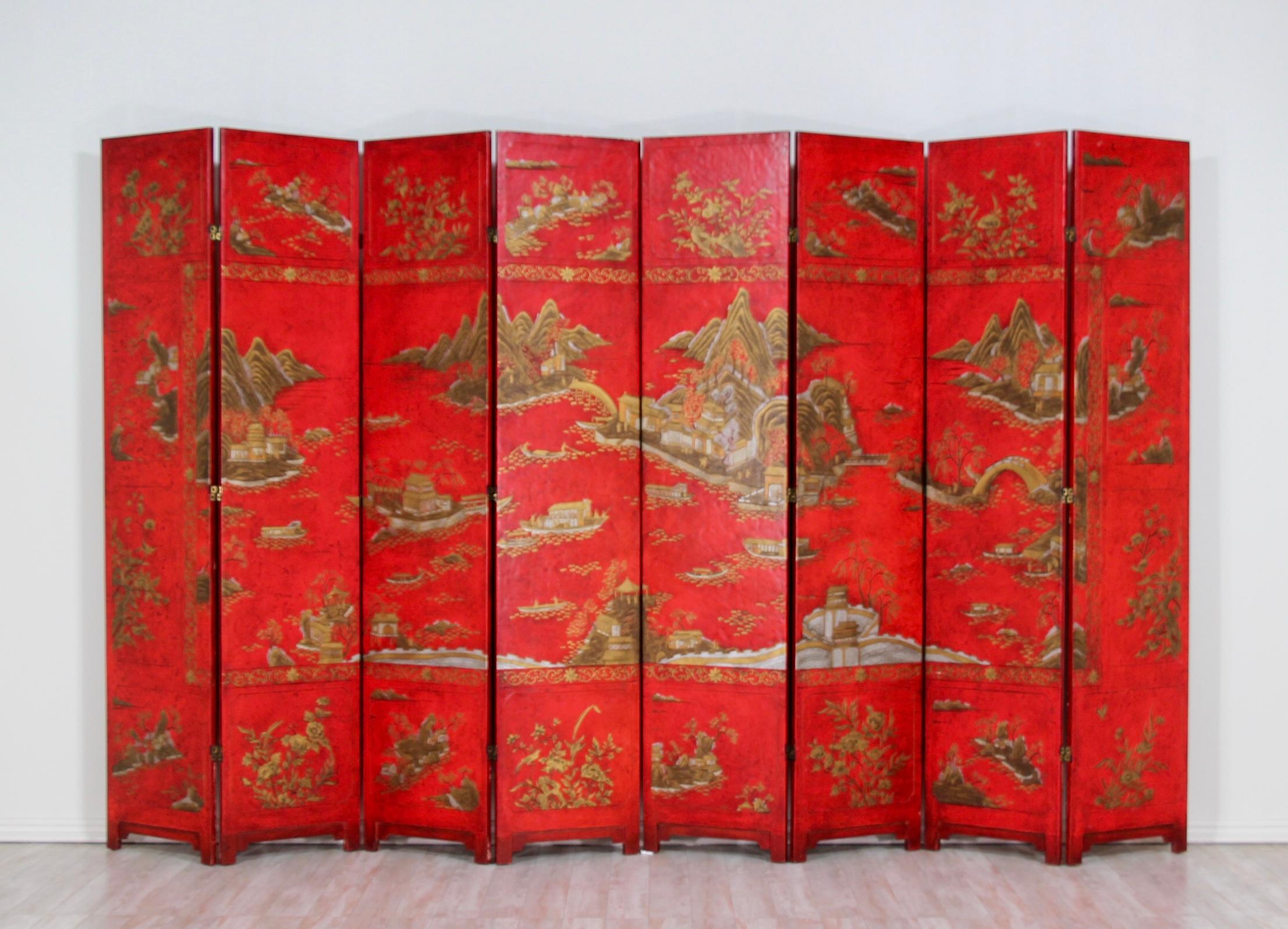 Monumental, eight-panel hand painted and lacquered Coromandel screen by Baker Furniture from the McMillen Collection. 

This impressive chinoiserie-style screen or room divider features 8 large panels lacquered in a rich cinnabar-red paint finish