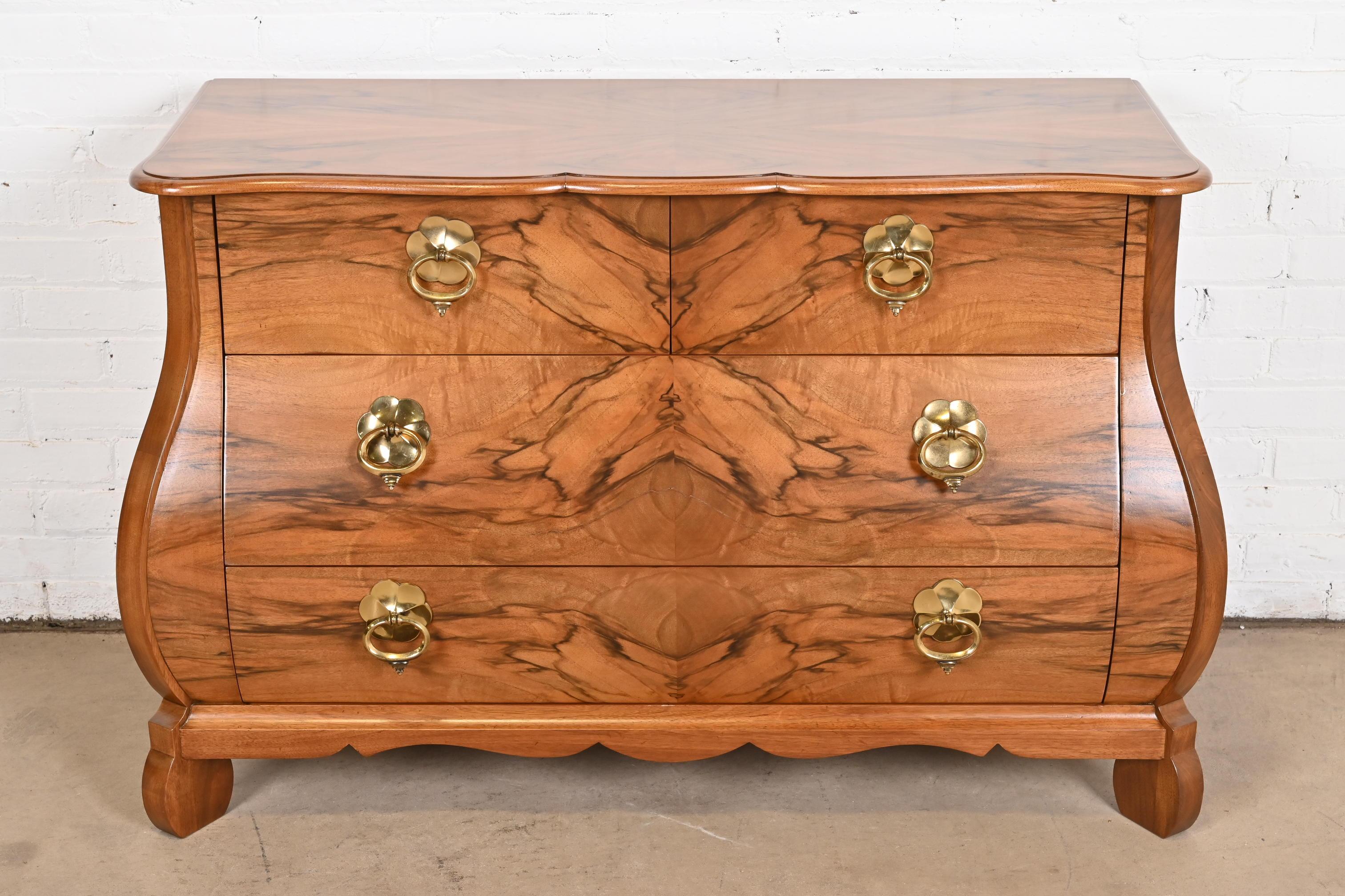A gorgeous Dutch or French Provincial Louis XV style bombay chest, commode, or dresser

By Baker Furniture

USA, Late 20th Century

Stunning book-matched burled walnut, with original brass hardware.

Measures: 47.5