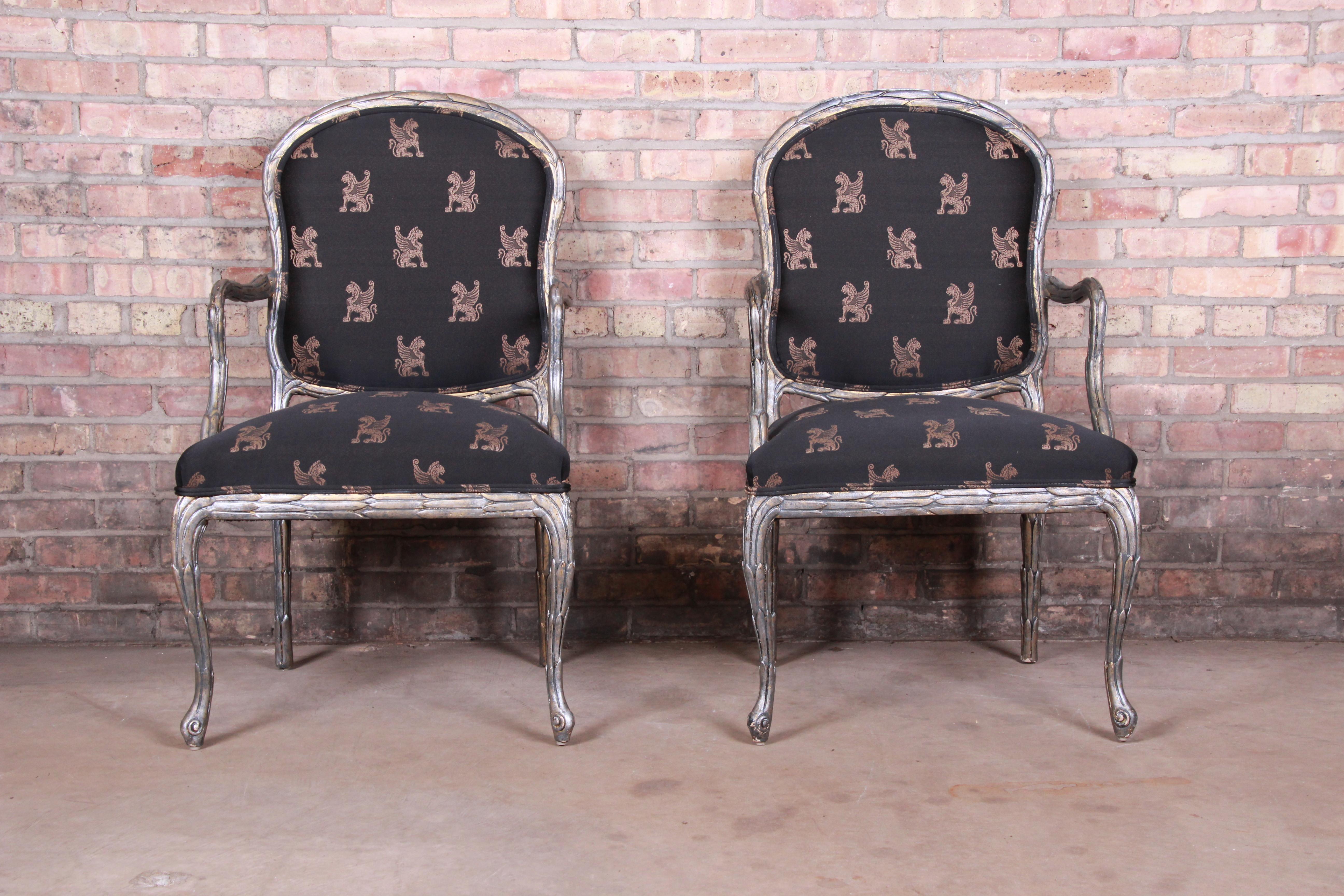 A stunning pair of French Louis XV style fauteuils

By Baker Furniture

USA, circa 1970s

Carved silver gilt over gold gilt wood frames, with unique griffin patterned upholstery.

Measures: 23.5