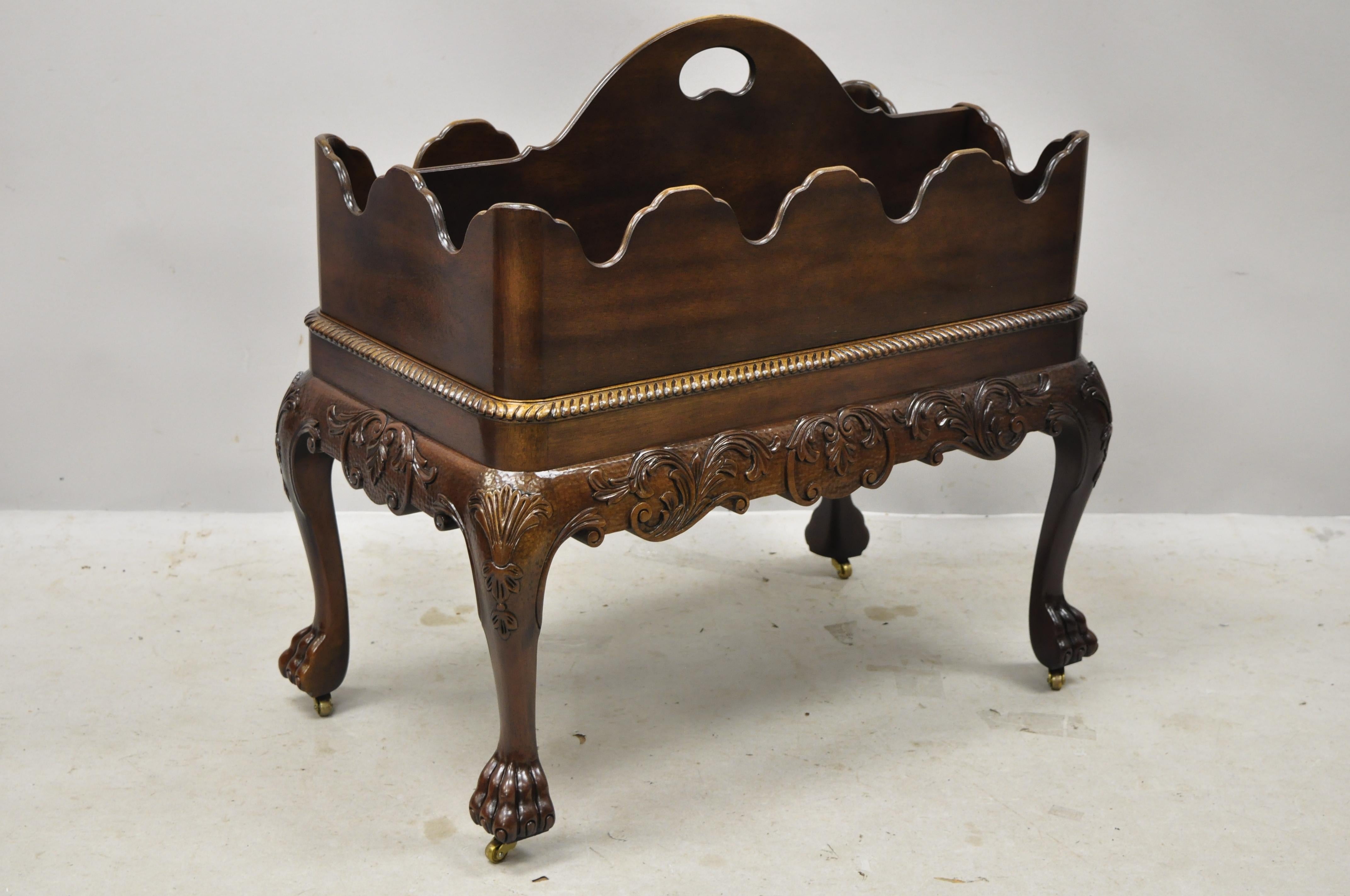 Baker Furniture mahogany Georgian paw feet Canterbury magazine rack stand. Item features lift off canterbury, brass rolling casters, solid wood construction, beautiful wood grain, nicely carved details, original label, carved ball and claw feet,