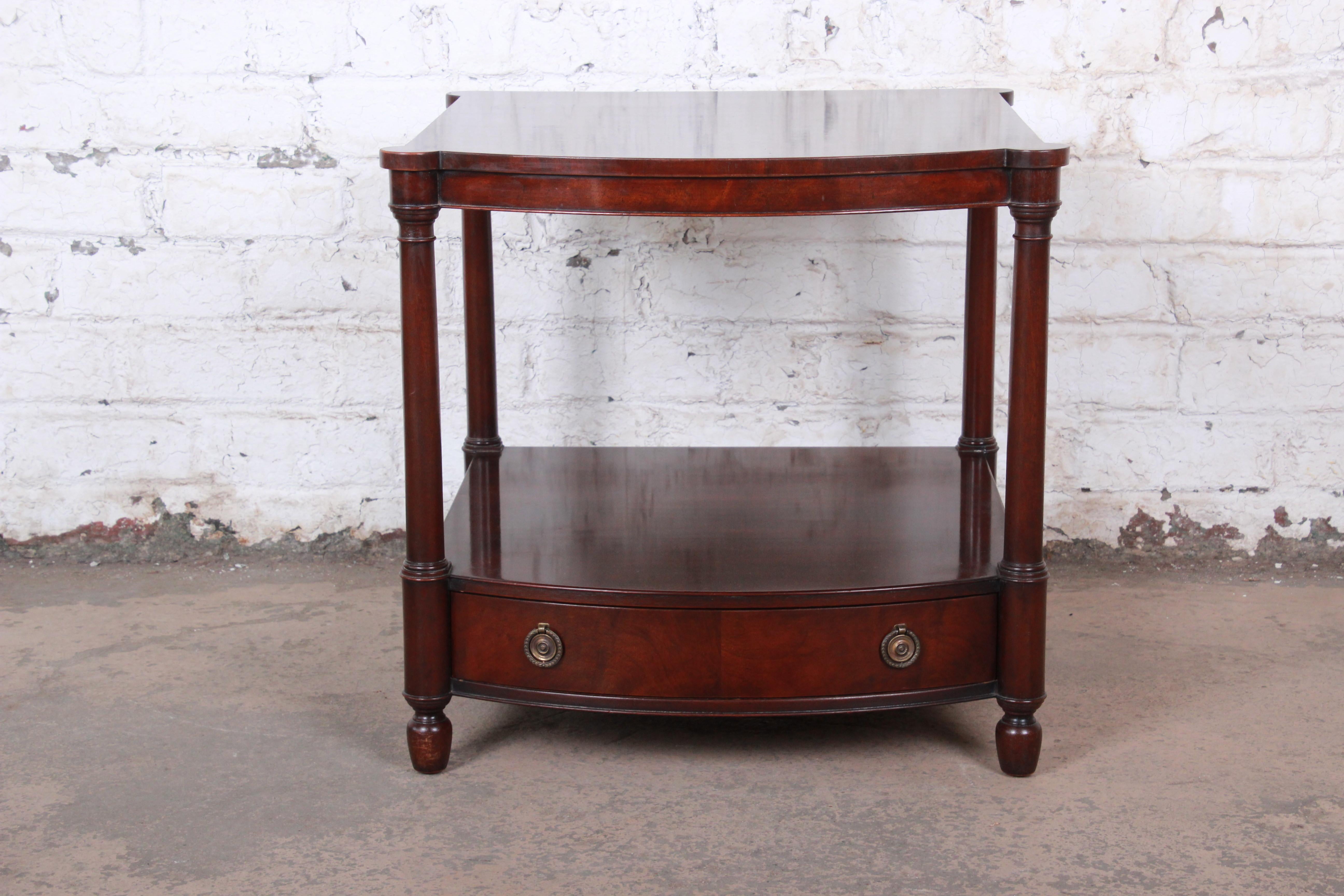 A gorgeous English traditional style mahogany occasional side table or nightstand

By Baker Furniture

USA, circa 1950s

Mahogany and brass hardware

Measures: 24