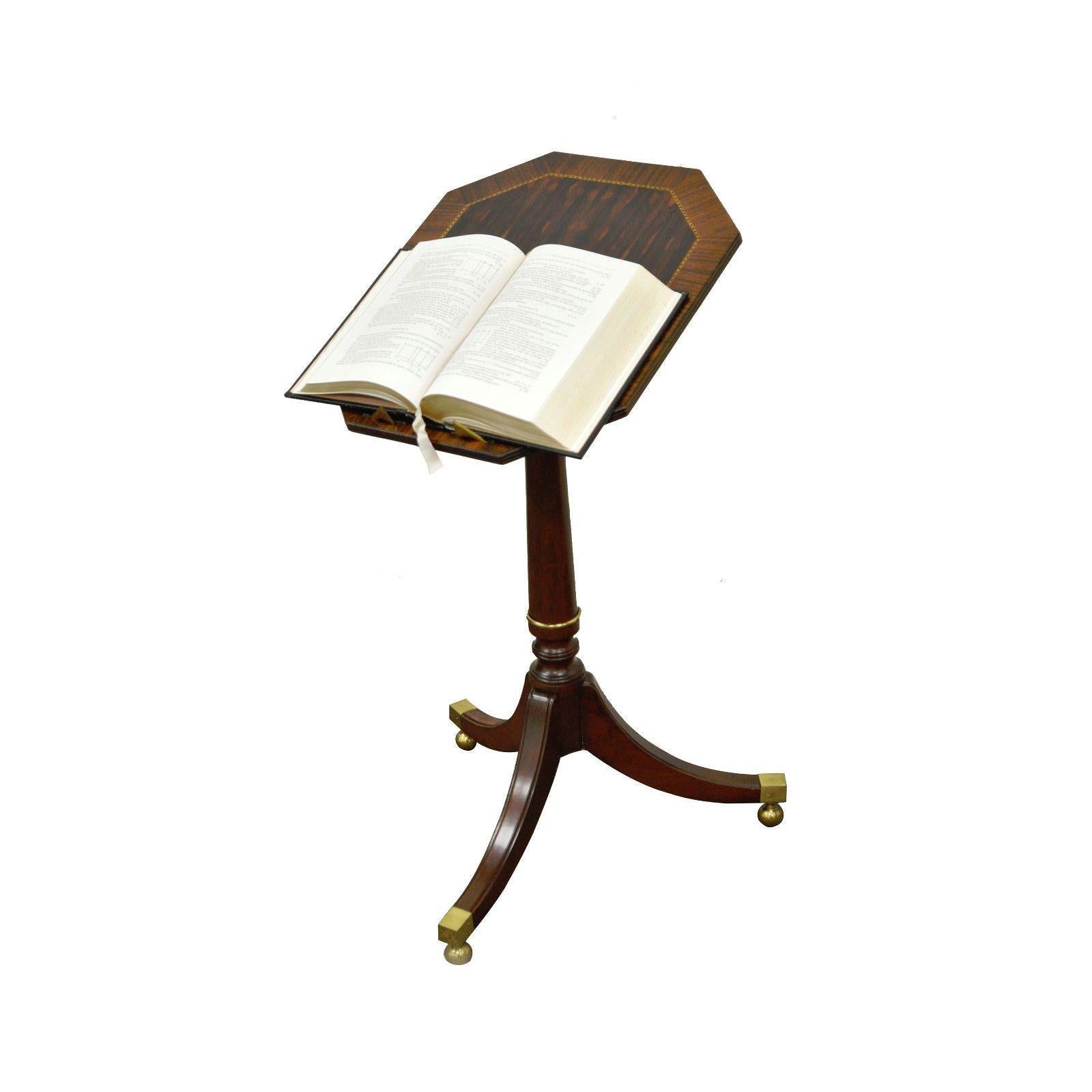 Vintage Baker Furniture tilt-top book stand / accent table. Item features beautiful mahogany base, Tilting rosewood and other exotic wood inlaid top, Solid brass accents with pop out brass book holders on the top. Great quality item, circa mid-late