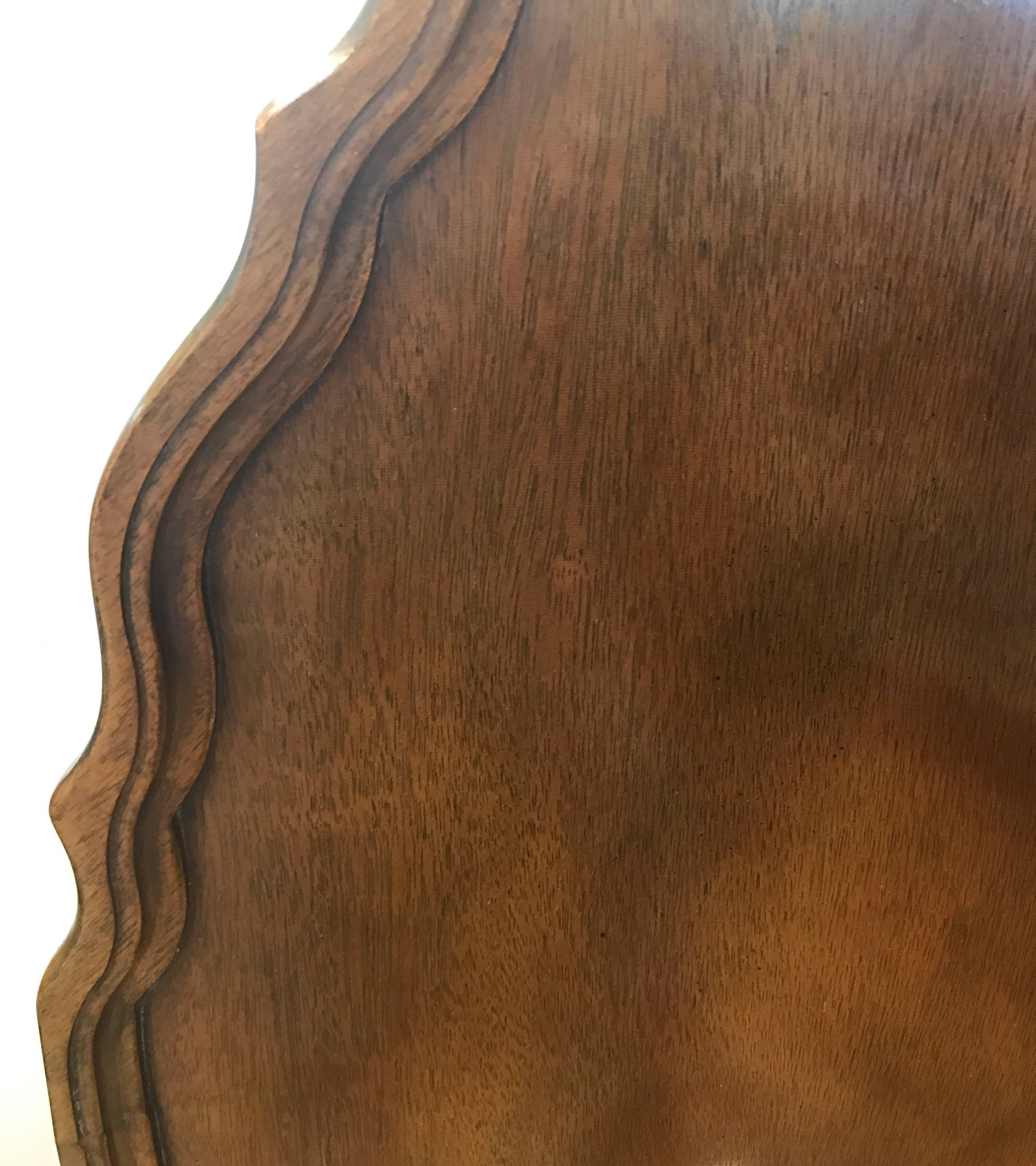 Elegant Baker Furniture signed mahogany tilt-top occasional table.