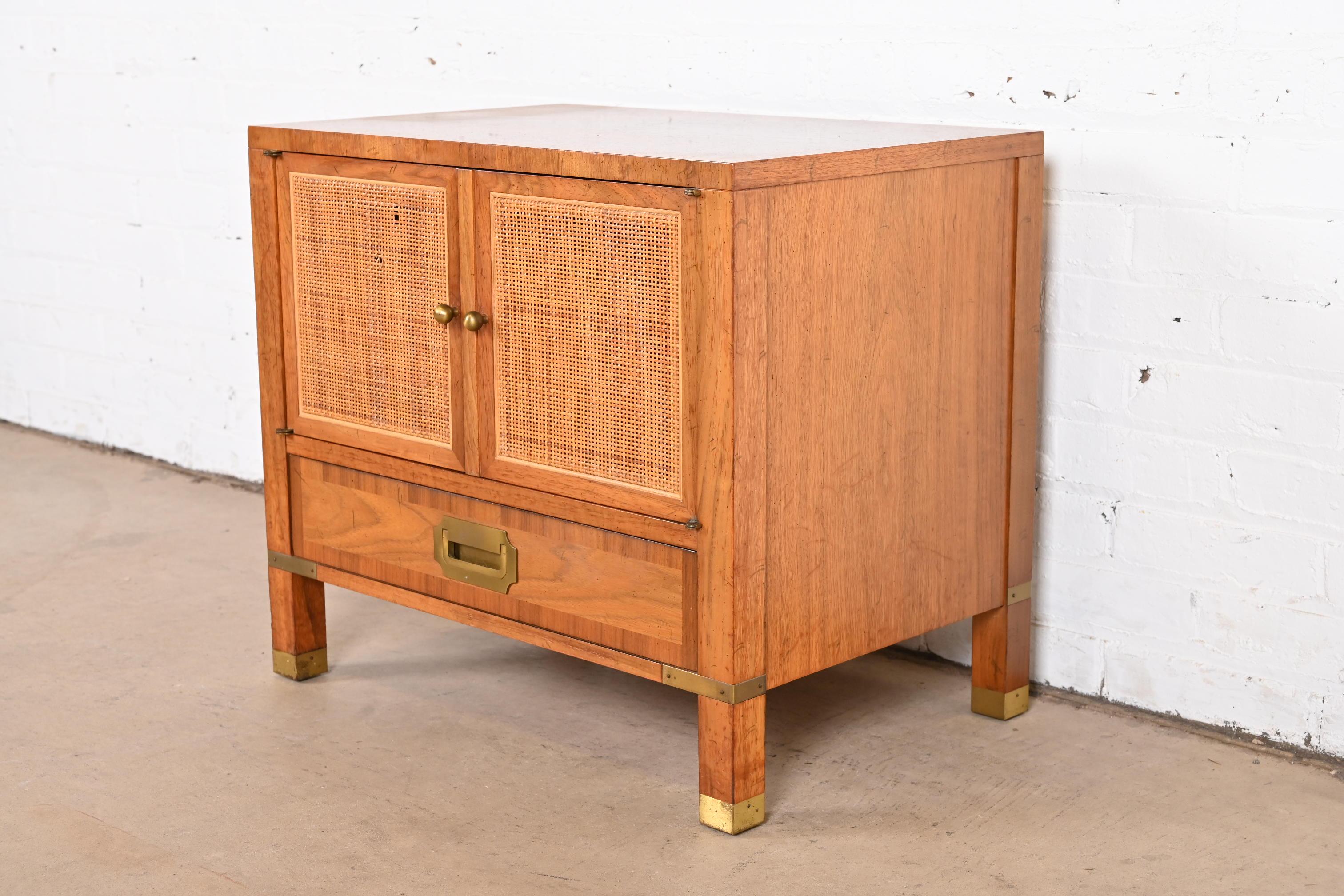 American Baker Furniture Mid-Century Campaign Walnut, Cane, and Brass Nightstand, 1960s For Sale