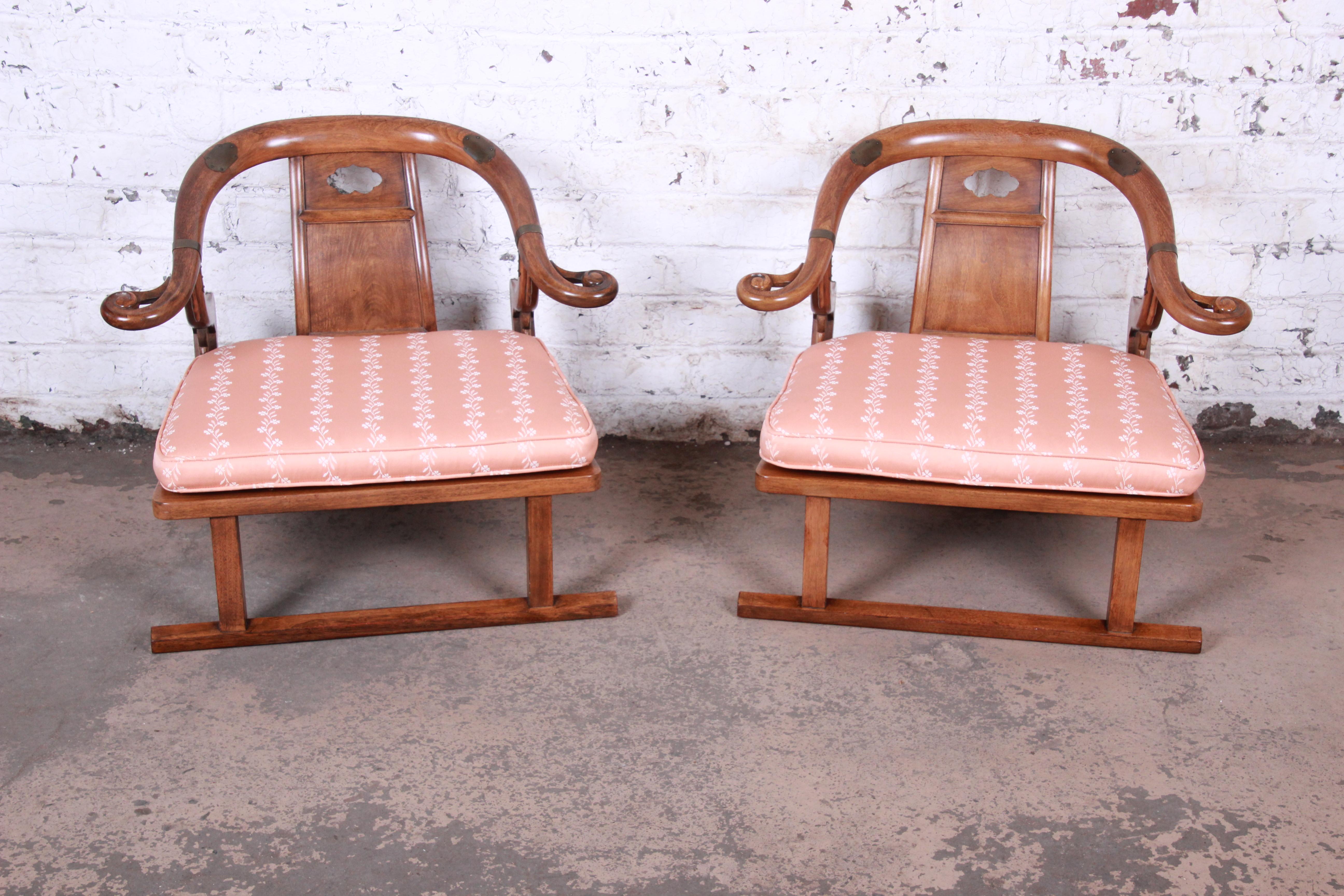 An exceptional pair of midcentury Chinese yoke back low lounge or slipper chairs

By Baker Furniture

USA, circa 1960s

Walnut + brass + uphlolstery

Measures: 31