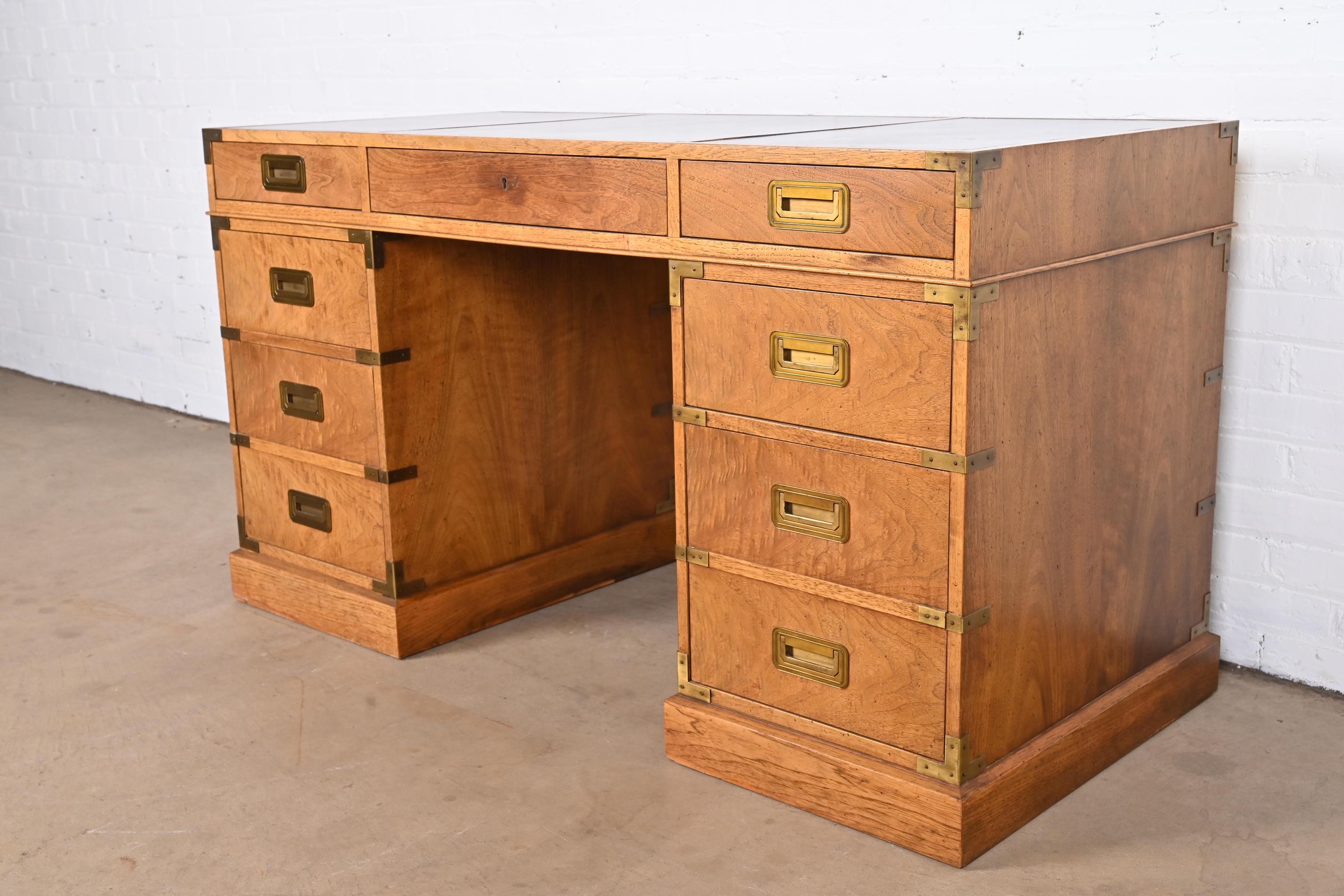 A gorgeous Mid-Century Modern Hollywood Regency Campaign style executive writing desk

By Baker Furniture, 