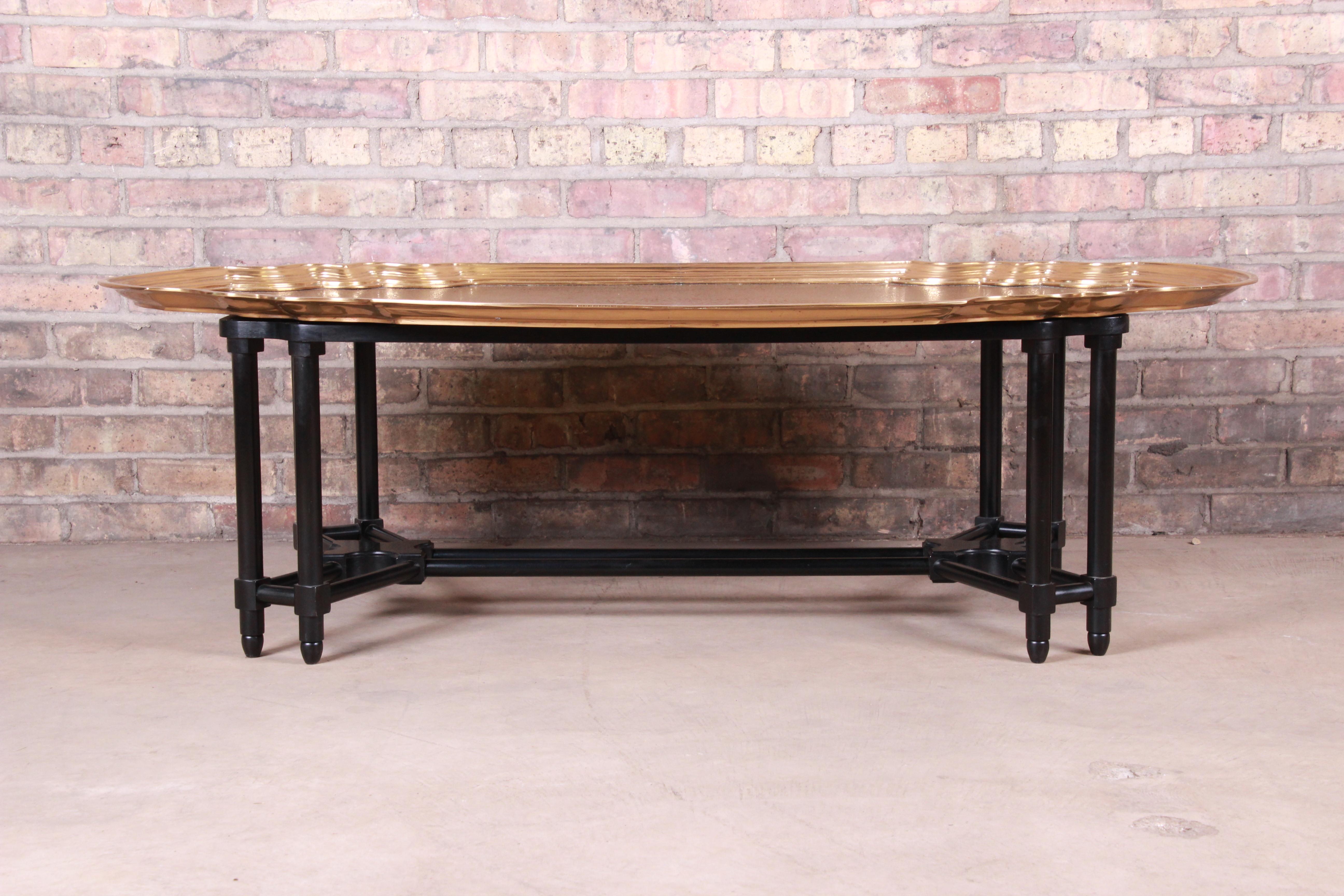 An exceptional midcentury Hollywood Regency chinoiserie coffee or cocktail table

By Baker Furniture

USA, circa 1960s

Black lacquered wood base, with etched solid brass top.

Measures: 55.25
