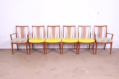 Baker Furniture Mid-Century Modern Sculpted Walnut and Rattan Dining Chairs
