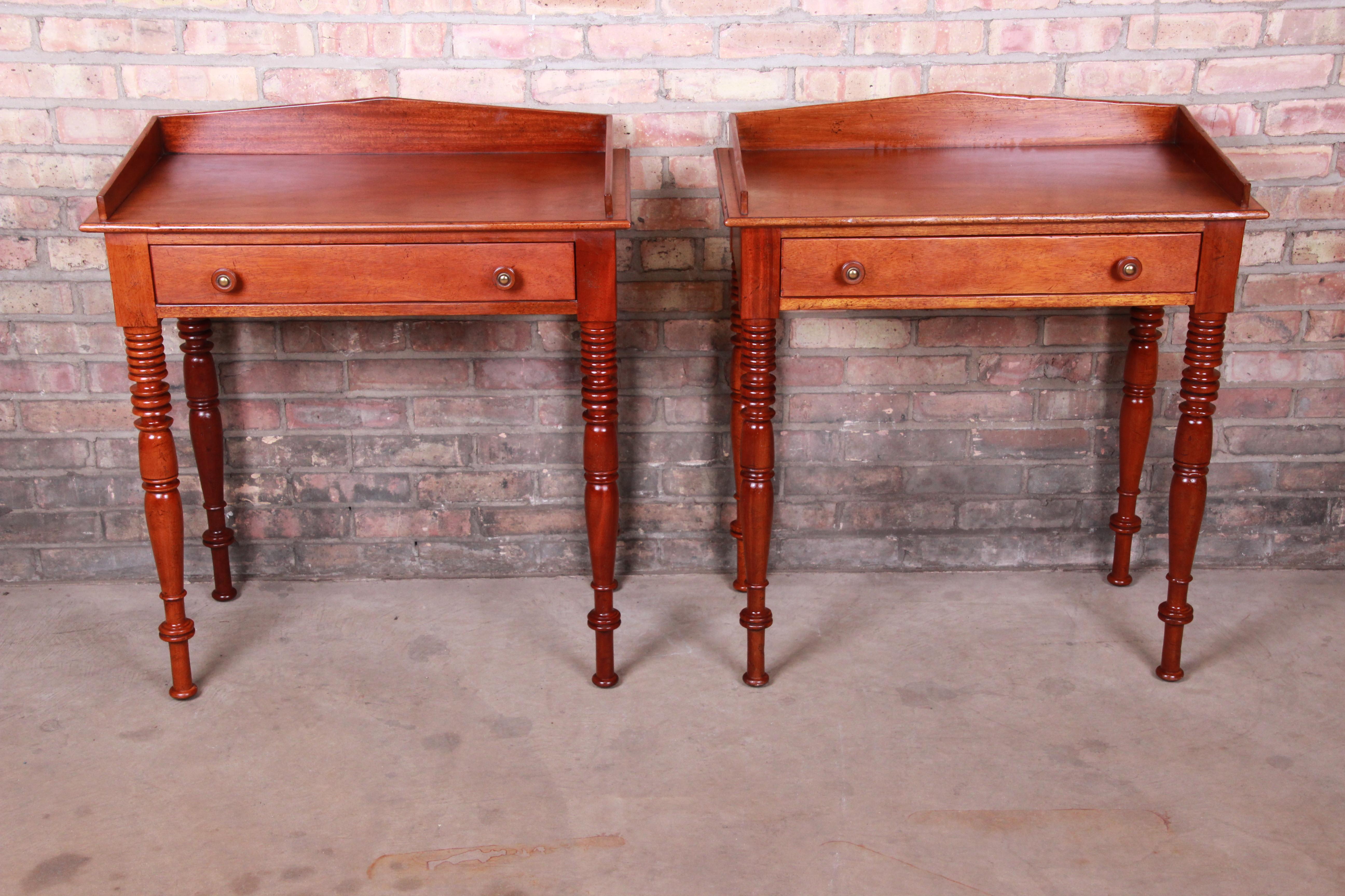 An exceptional pair of carved mahogany nightstands or end tables

By Baker Furniture Milling Road 