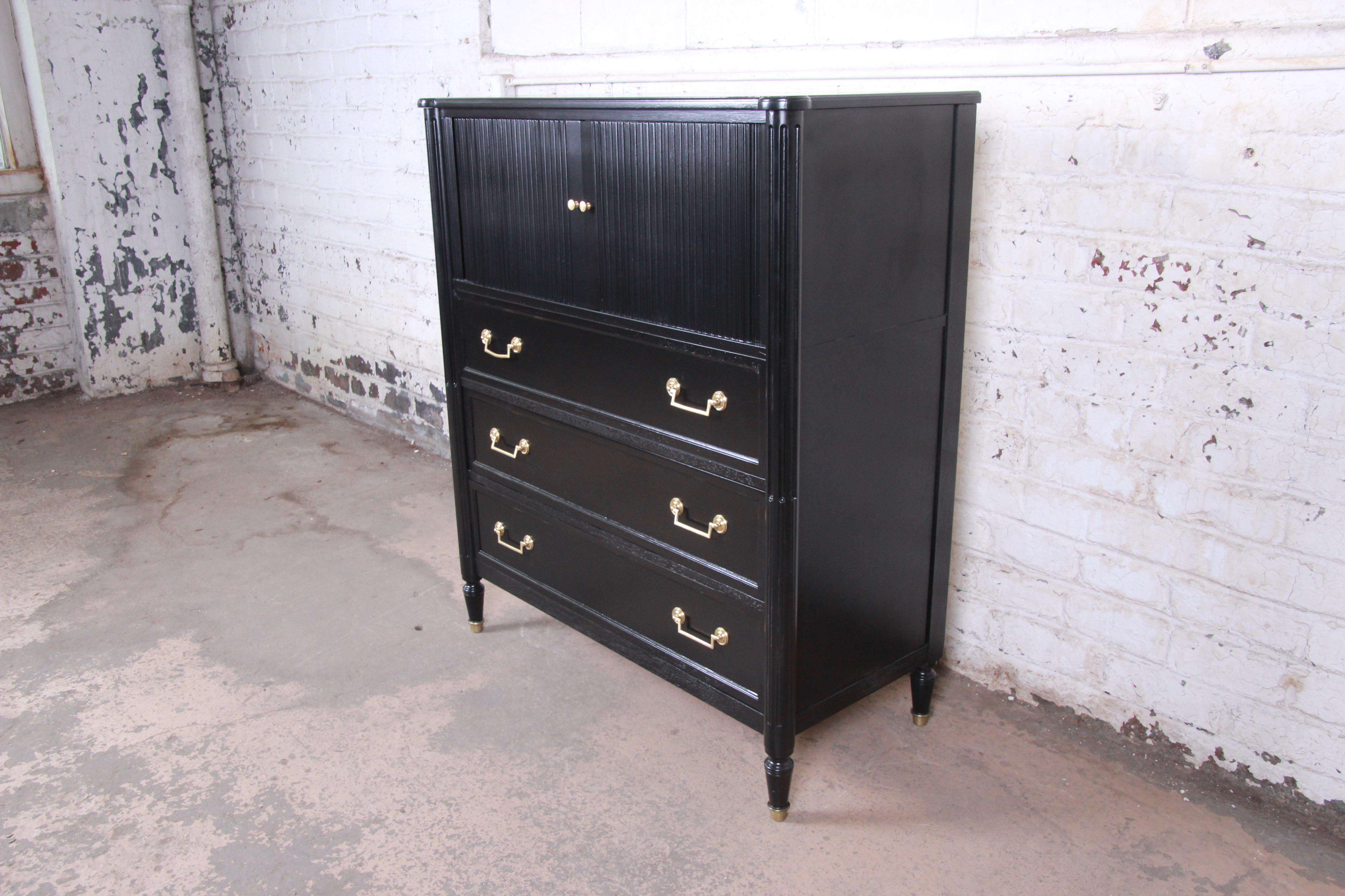 A gorgeous midcentury French Regency gentleman's chest dresser

From the Milling Road Collection by Baker Furniture

USA, circa 1960s

Newly ebonized walnut and original brass hardware

Measures: 42