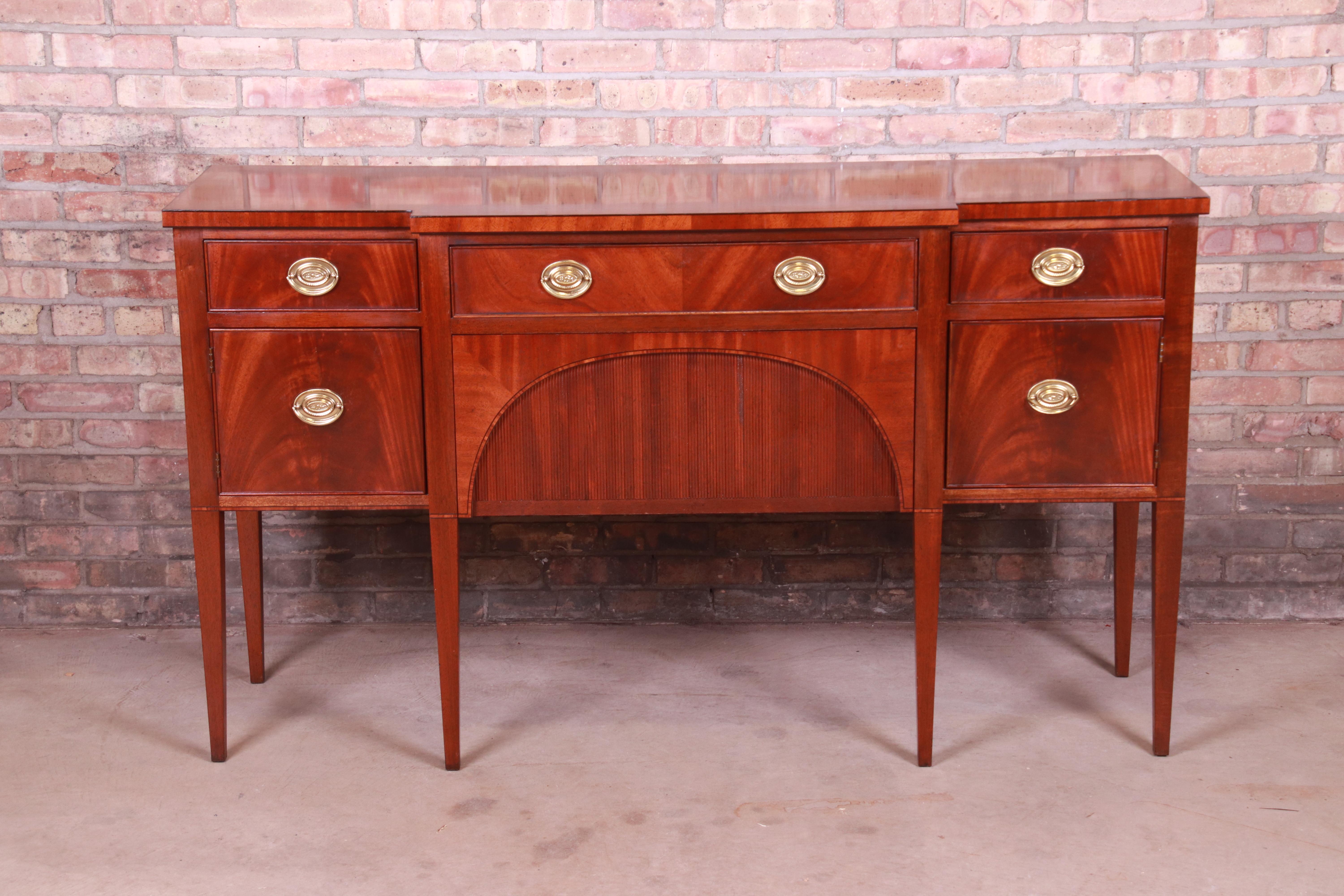 An exceptional Hepplewhite or Federal style sideboard, credenza, or buffet

By Baker Furniture 