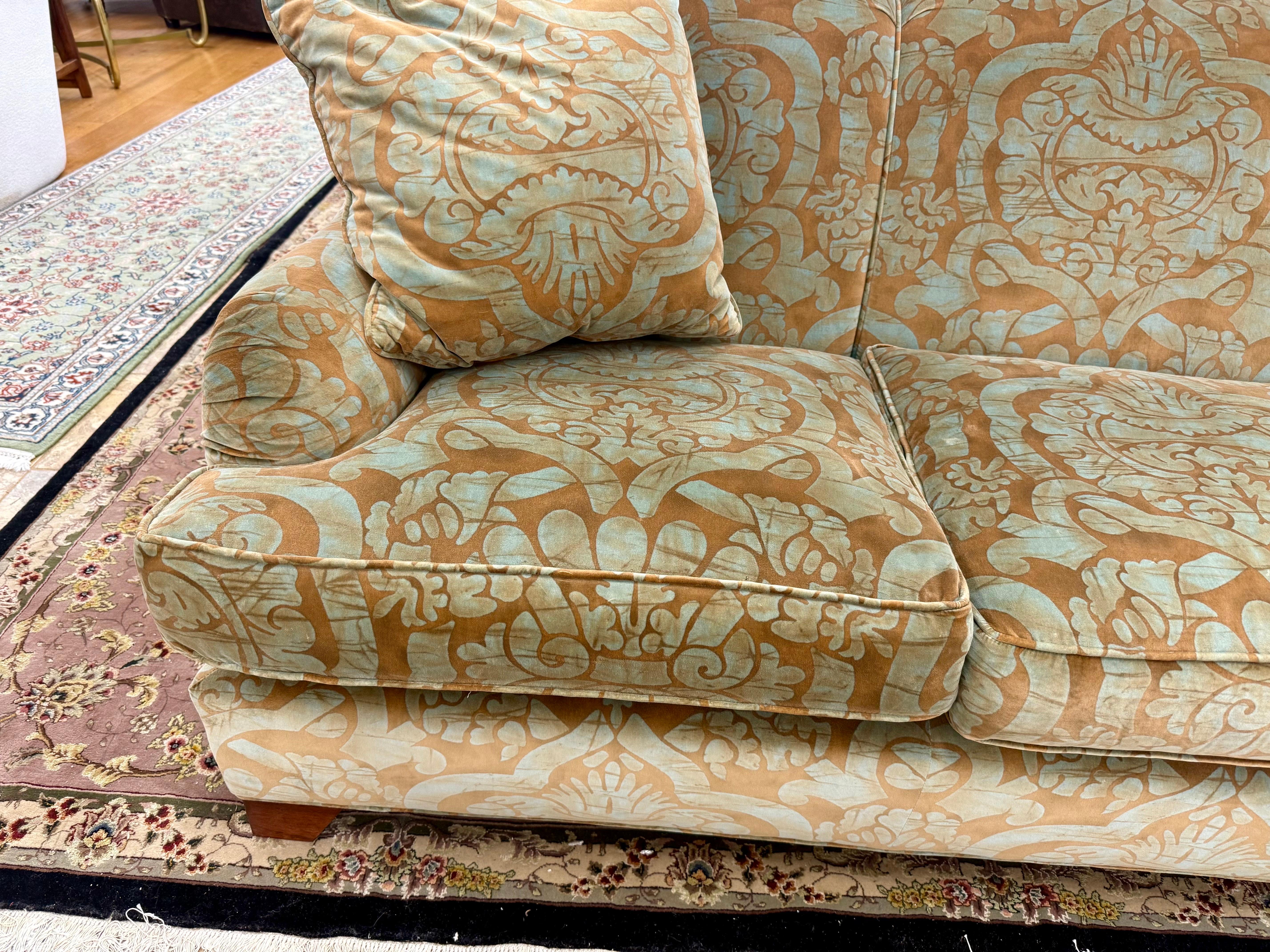 Stunning Baker Furniture Milling Road seven foot sofa with elegant and scene stealing upholstery.  Condition is very good and note it does have a little sun fading mostly on the back.  Will be the most comfortable seating you own.