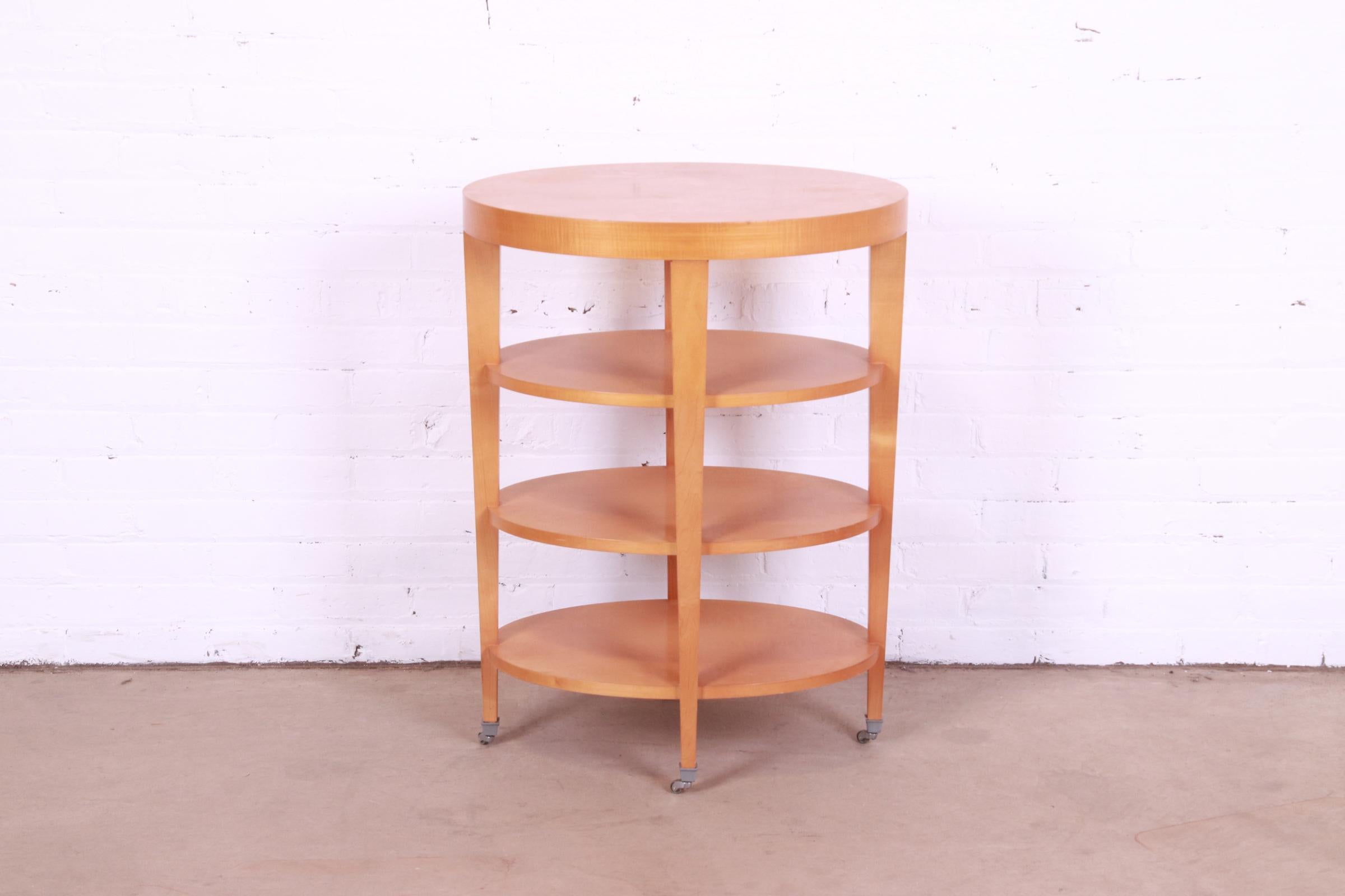 A gorgeous Modern Art Deco style four-tier maple tea table or occasional side table on casters

By Baker Furniture

USA, Late 20th Century

Measures: 24