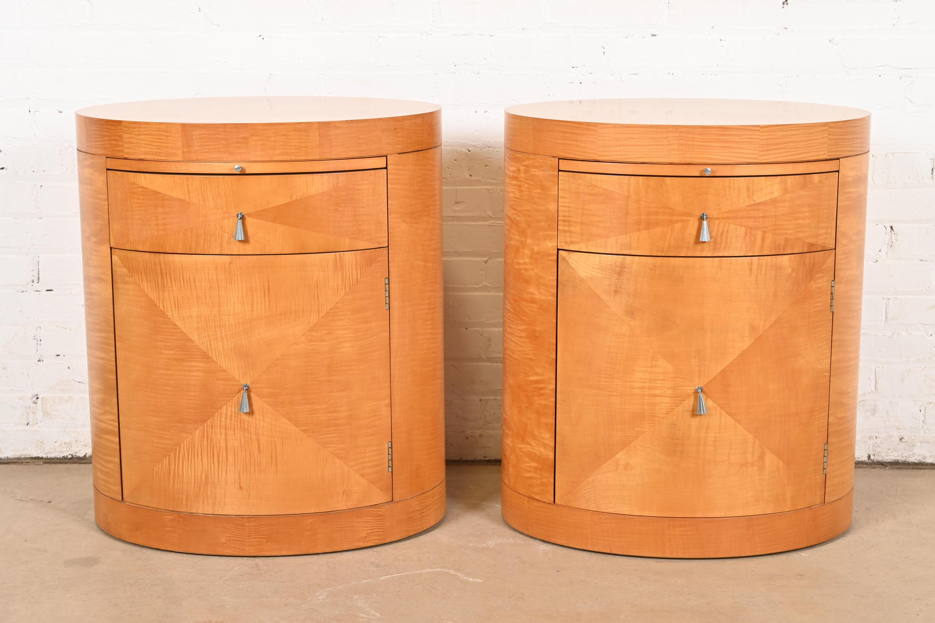 A stylish pair of Modern Art Deco oval nightstands or occasional side tables 

By Michael Vanderbyl for Baker Furniture

USA, Late 20th Century

Gorgeous inlaid primavera wood, with original nickel hardware.

Each measures: 24