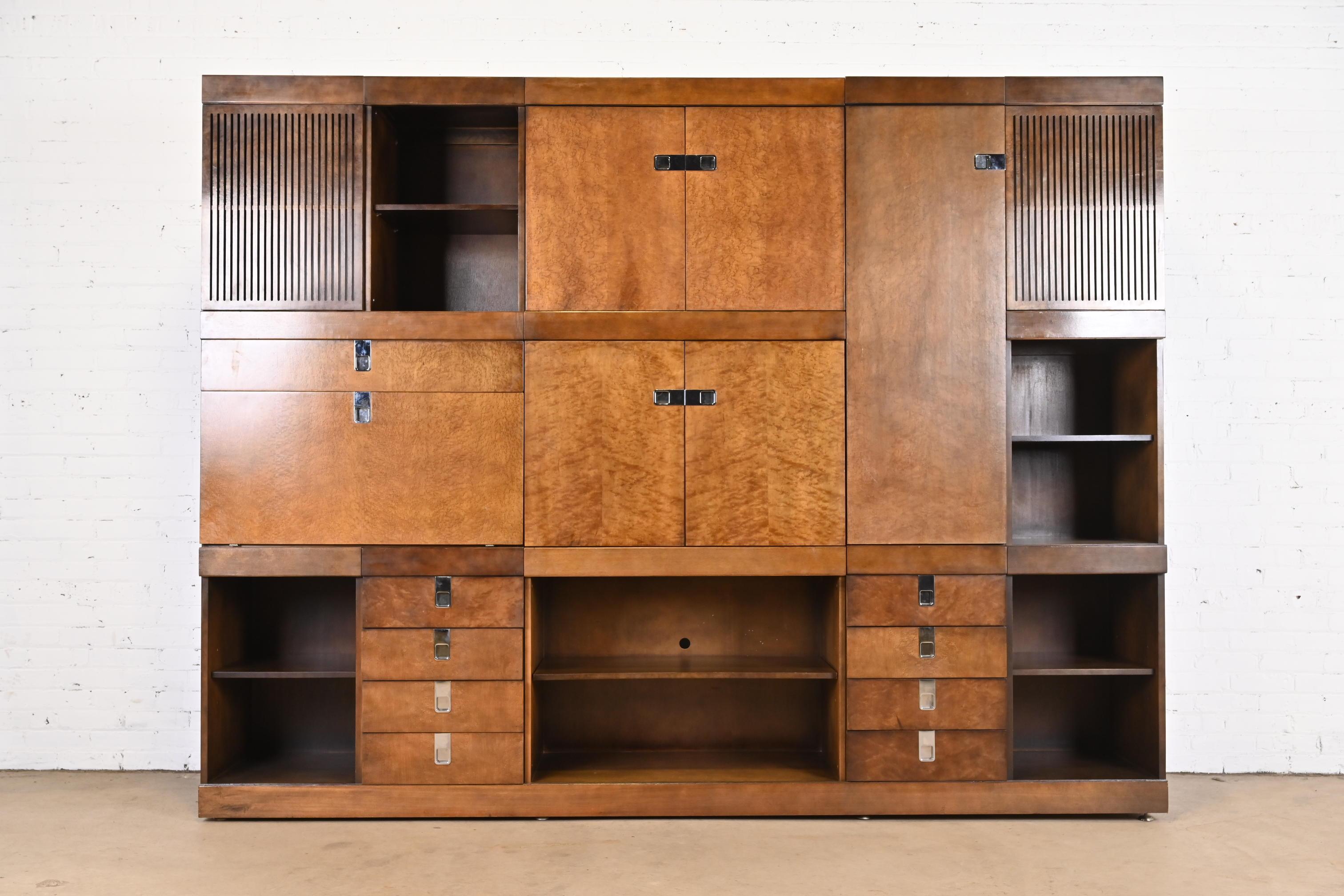 An exceptional monumental Mid-Century Modern modular wall unit

By Brian Palmer for Baker Furniture

USA, 1970s

Gorgeous birdseye maple, with chrome hardware, and mirrored back inside drop front bar cabinet.

Measures: 108