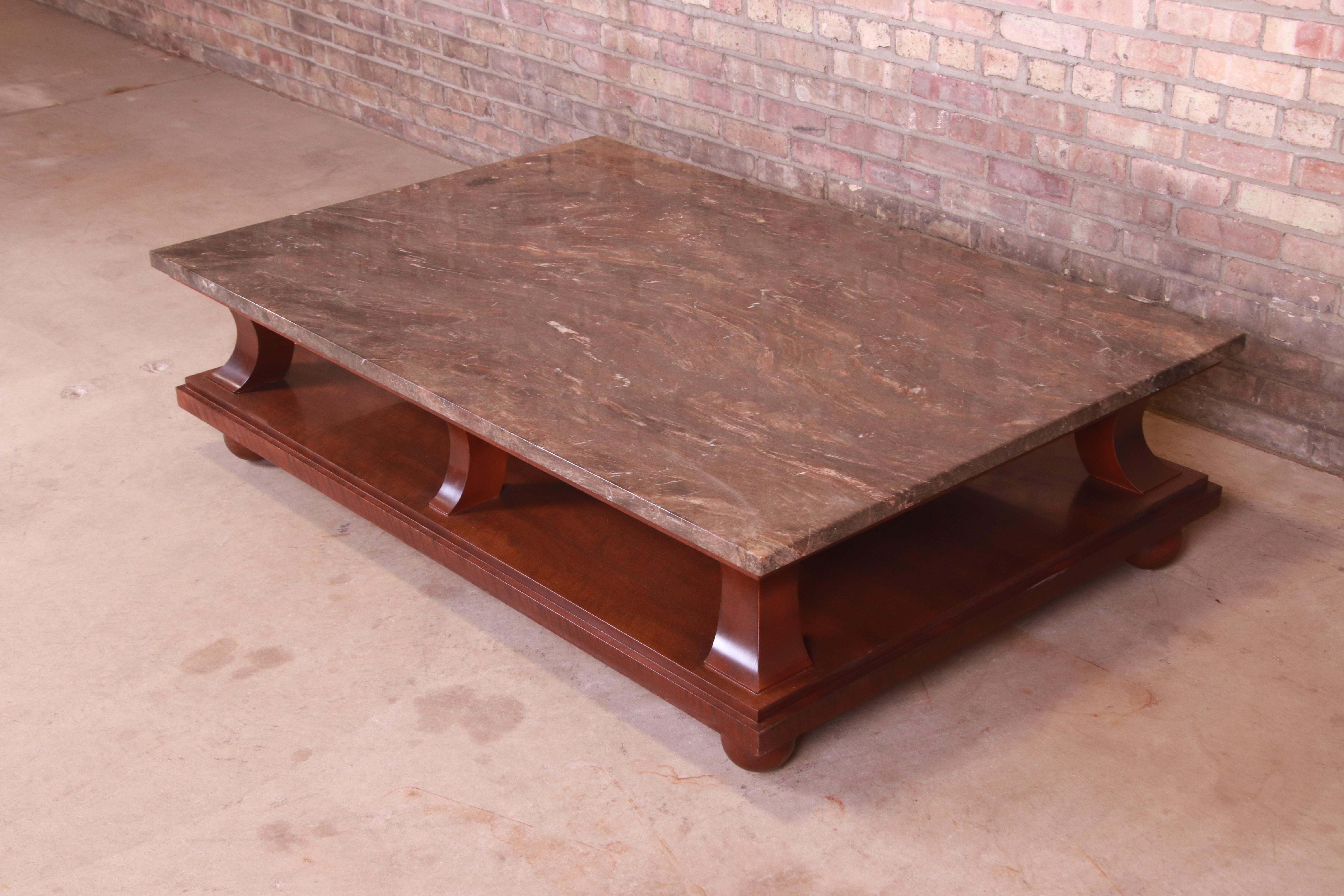 An exceptional monumental modern coffee or cocktail table

By Baker Furniture

Circa 1990s

Solid mahogany, with Italian marble top.

Measures: 60