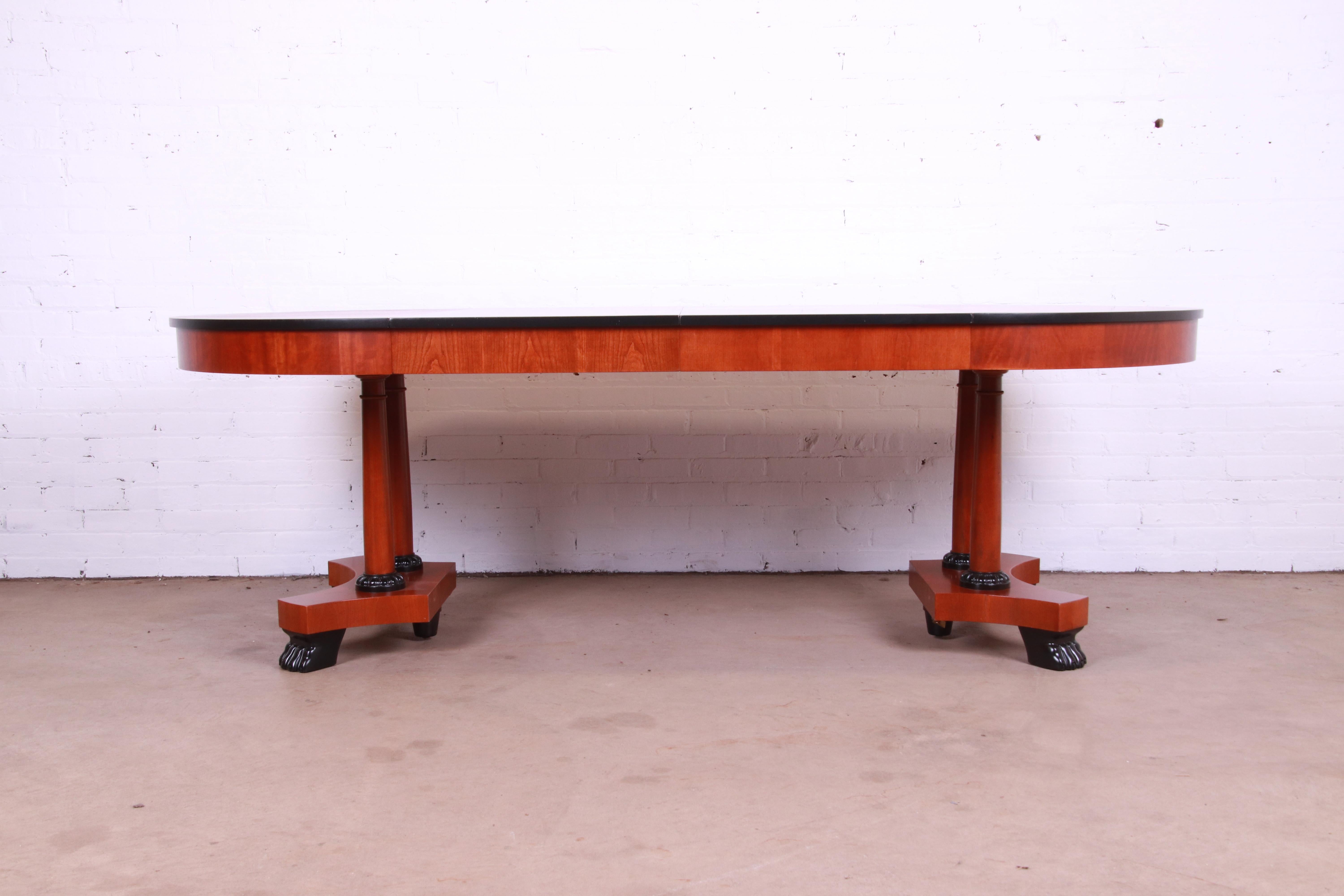 An exceptional Neoclassical or Empire style extension dining table.

By Baker Furniture, 