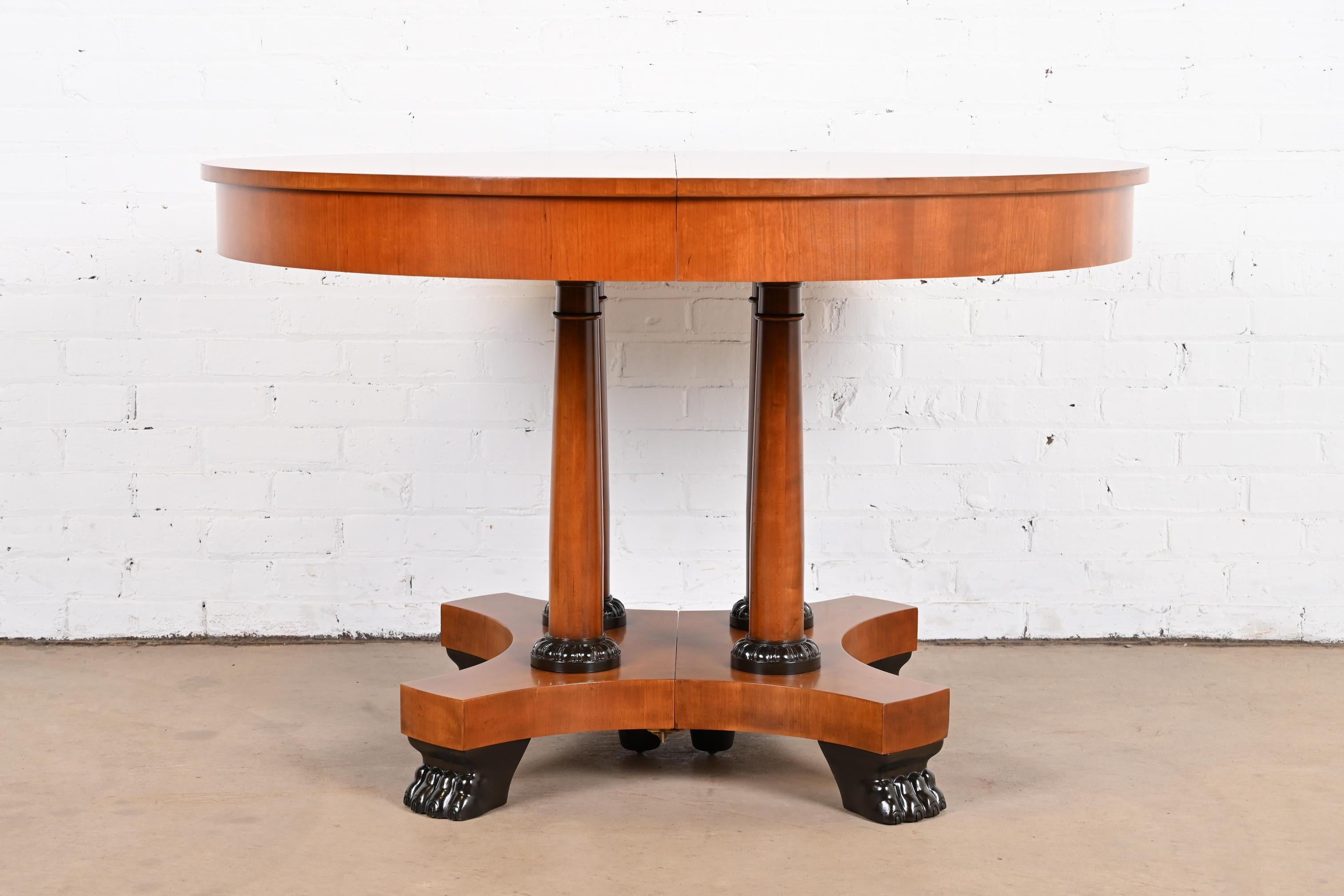 An exceptional neoclassical or Empire style extension pedestal dining table

By Baker Furniture, 