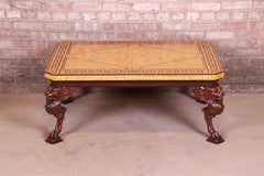 Baker Furniture Neoclassical Cocktail Table with Carved Lion Heads and Burl Top