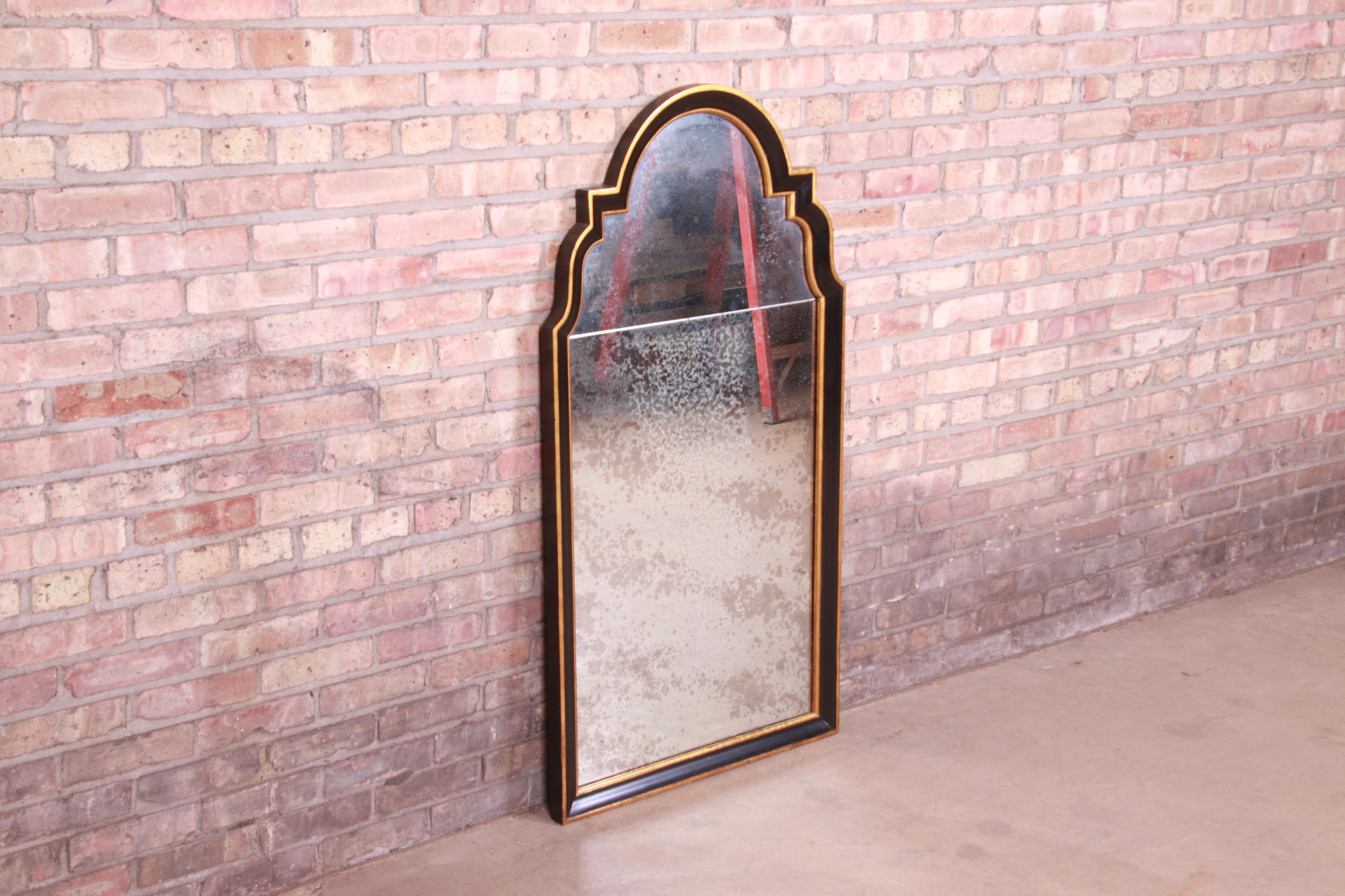 20th Century Baker Furniture Neoclassical Ebonized and Parcel Gilt Framed Mirror