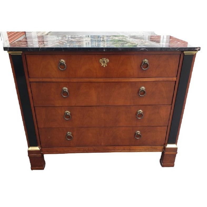 Michal Taylor designed for Baker Furniture Neoclassical Regency commode or chest of drawers. Rich marble top imported from the famous Carrara region in Italy. Thick Vertical Banded brass stripes on both sides of the dresser ad additional touch of