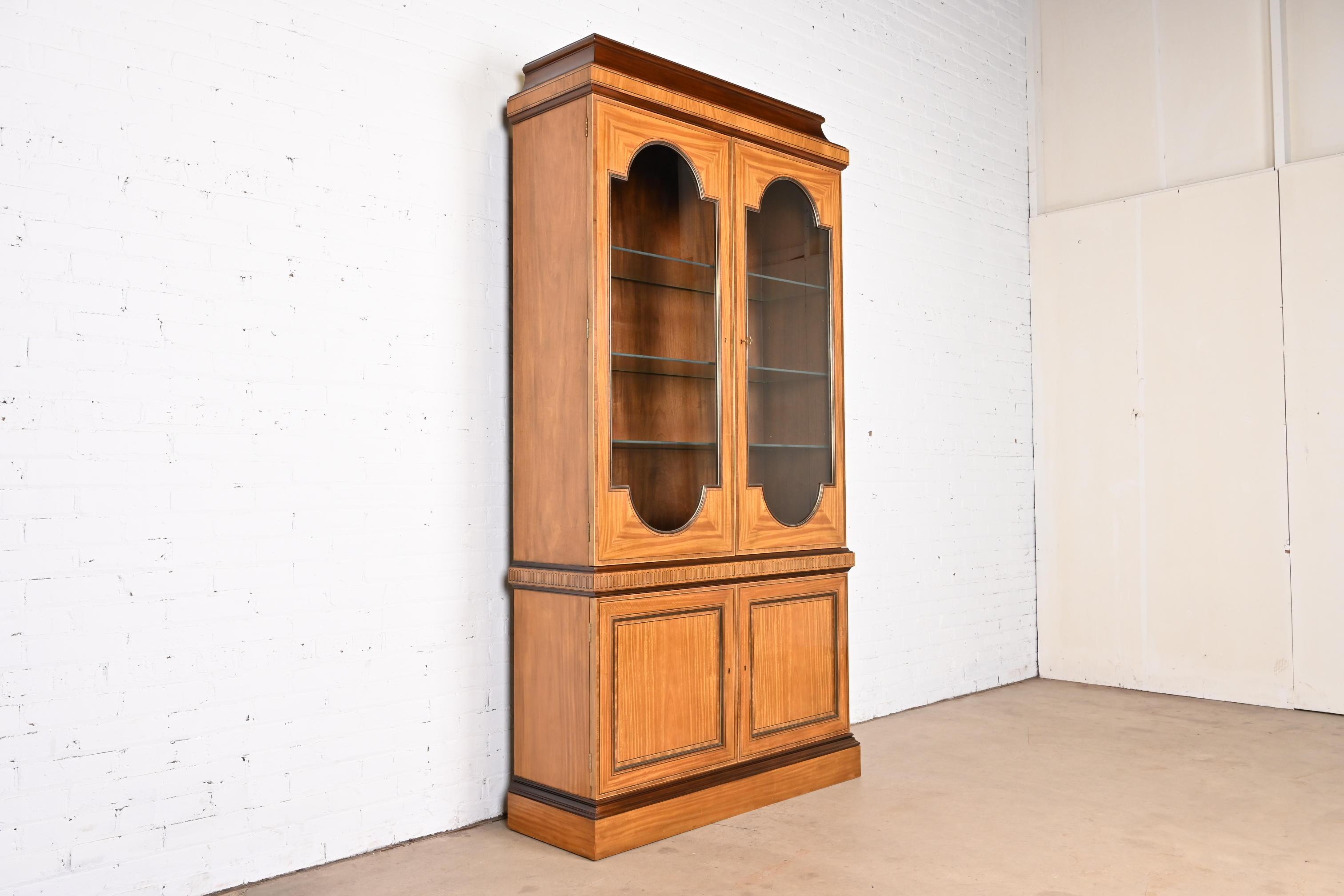 20th Century Baker Furniture Neoclassical Satinwood Lighted Breakfront Bookcase Cabinet For Sale