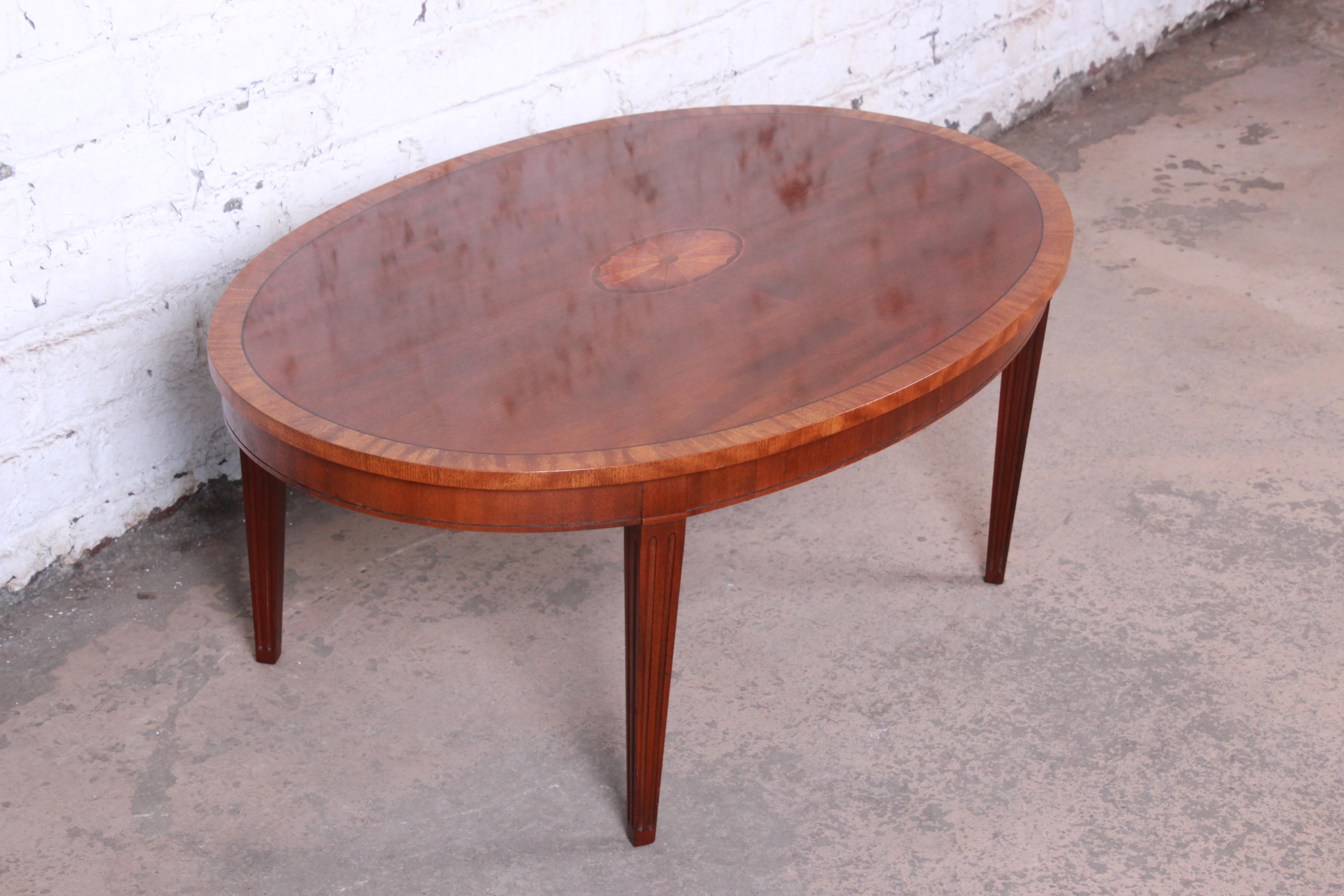 20th Century Baker Furniture Oval Inlaid Mahogany and Satinwood Marquetry Cocktail Table
