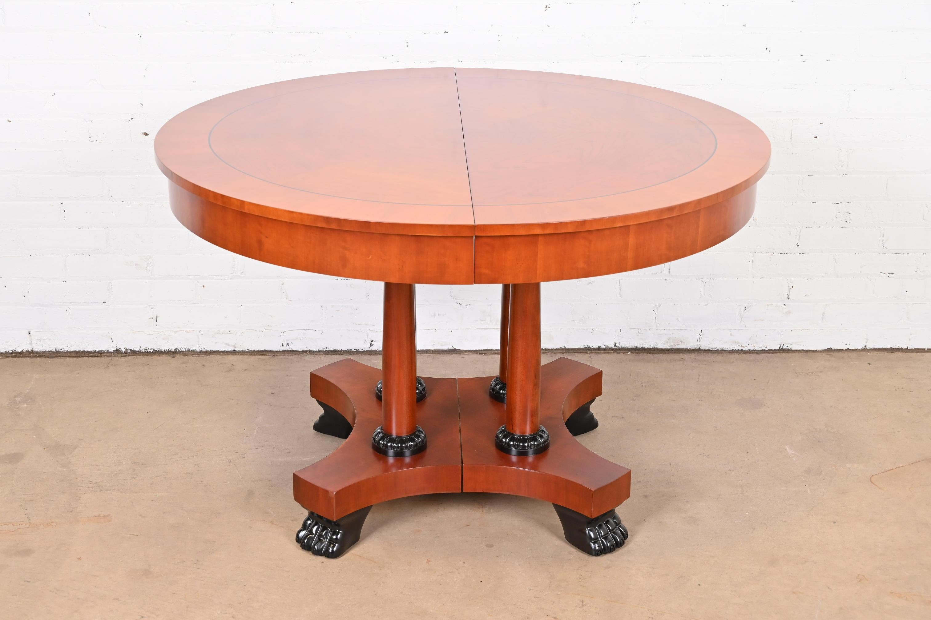 A gorgeous Neoclassical or Empire style extension dining table

By Baker Furniture, 