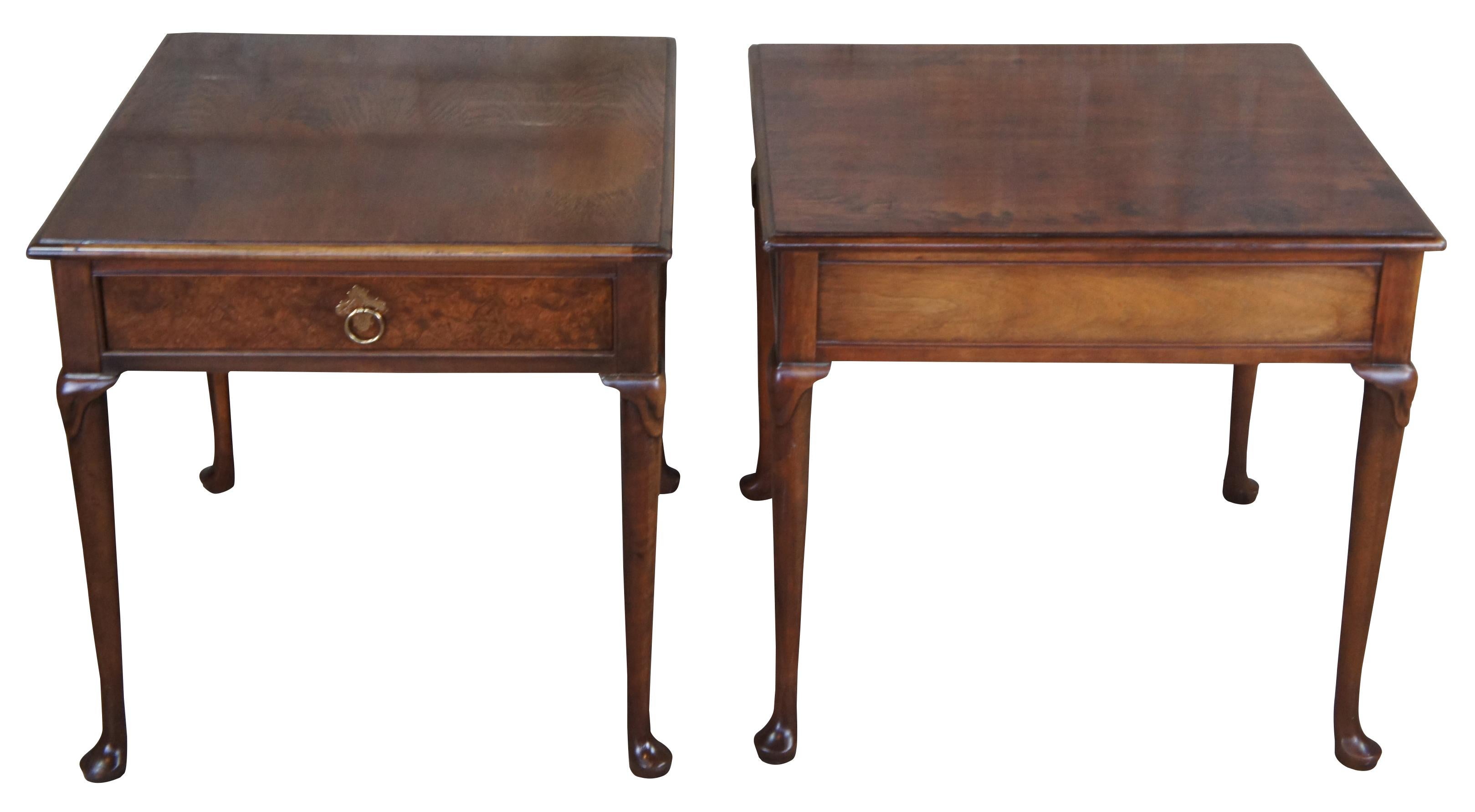 Pair of late 20th century Baker Furniture side tables. Made from walnut with a rectangular form over tapered legs leading to pad feet. Features one drawer with burled front and brass knocker pull.
 