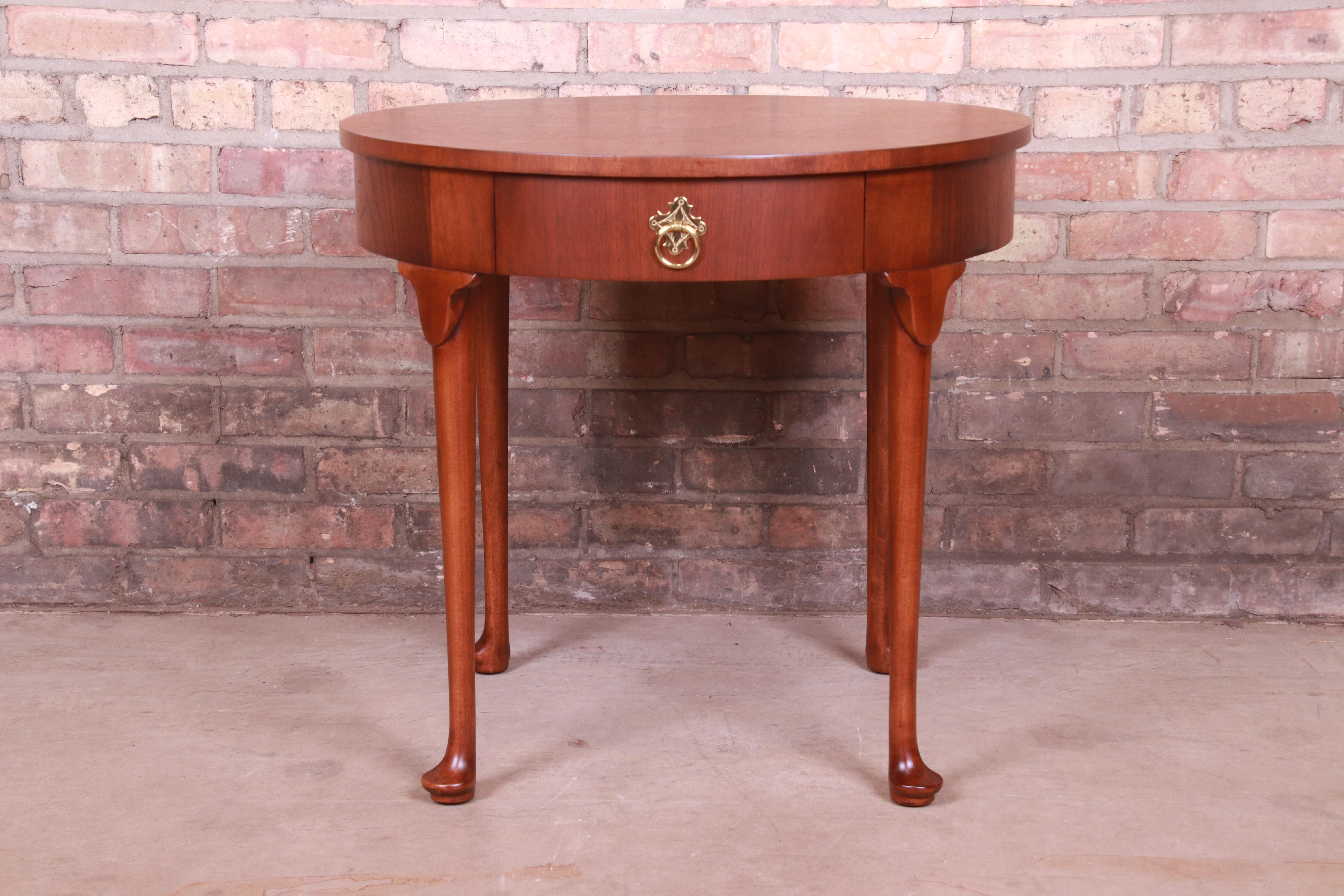A gorgeous Queen Anne style occasional side table, nightstand, or tea table

By Baker Furniture

USA, Circa 1980s

Walnut, with original brass hardware.

Measures: 25.75